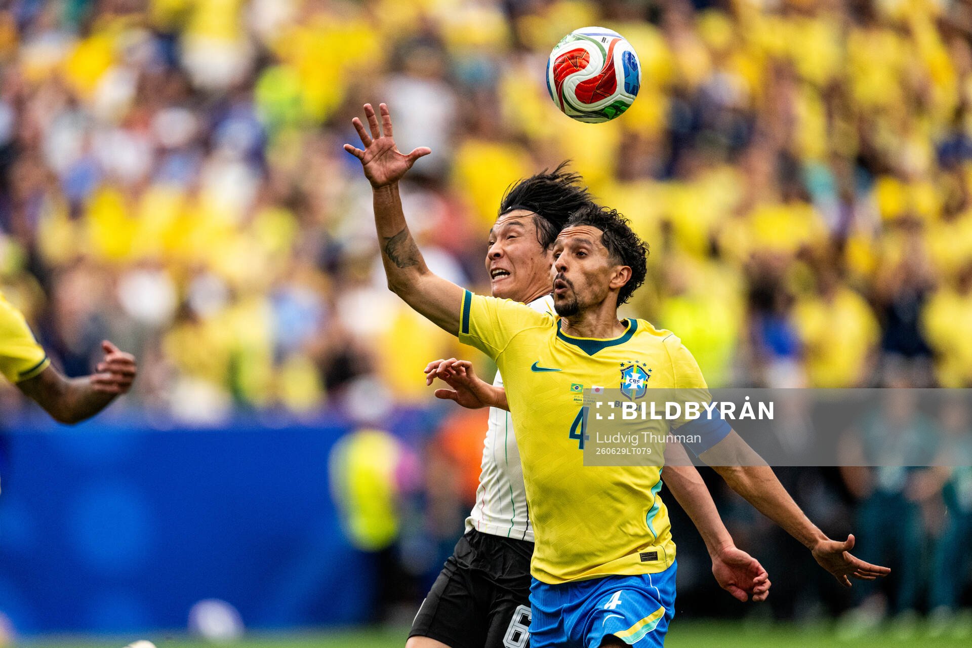 Wataru Endo of Japan and Marquinhos of Brazil
