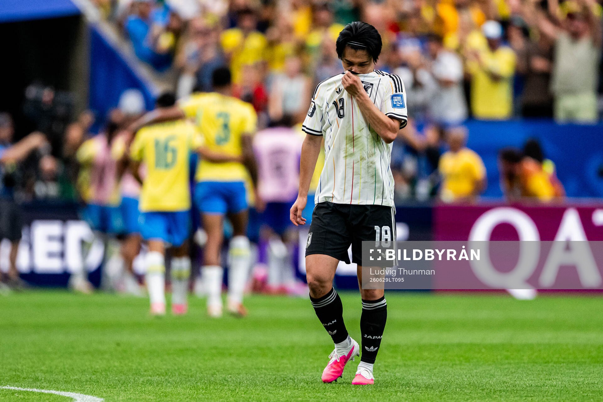 Ayase Ueda of Japan looks dejected