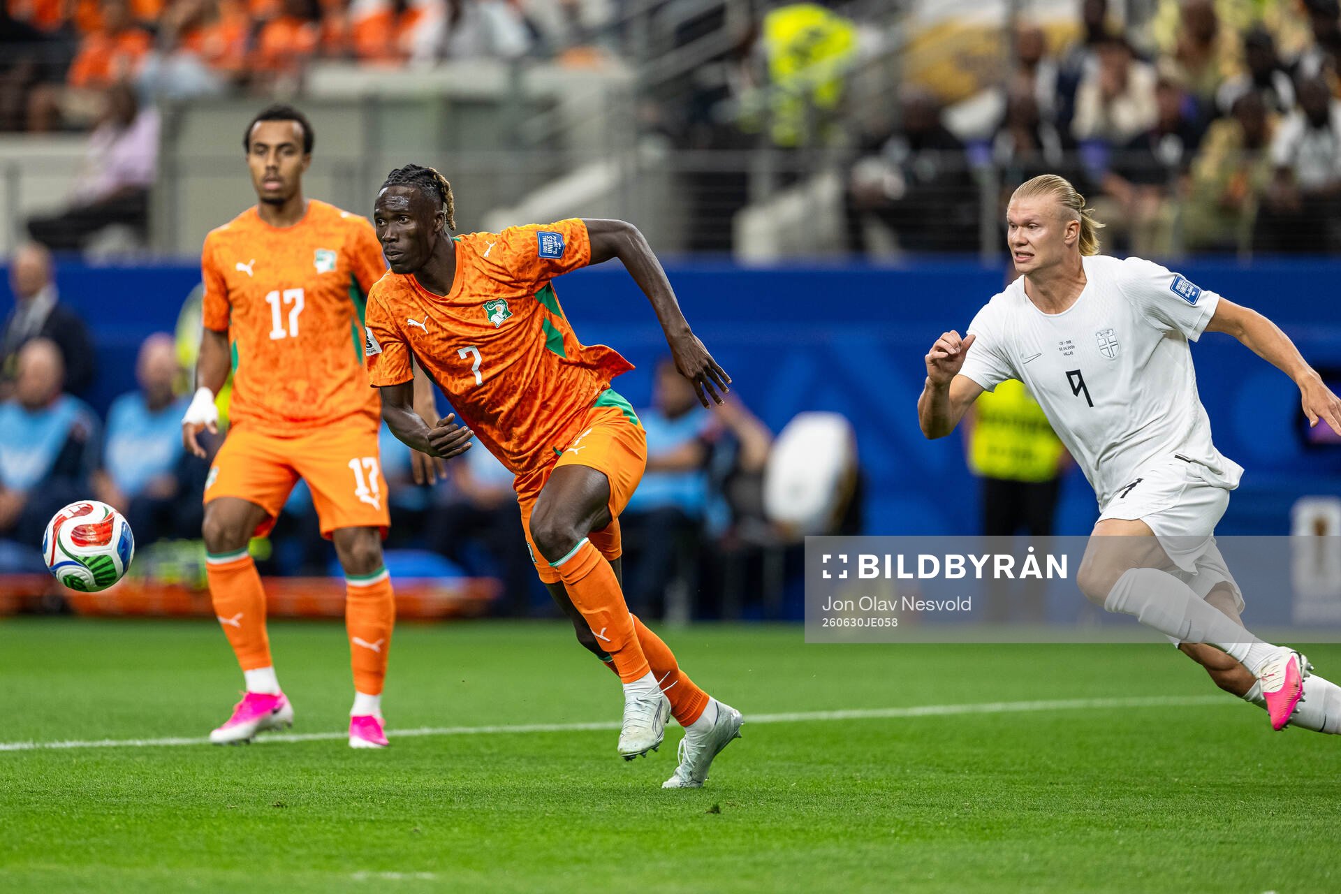 Odilon Kossounou of Côte d'Ivoire and Erling Braut Haaland