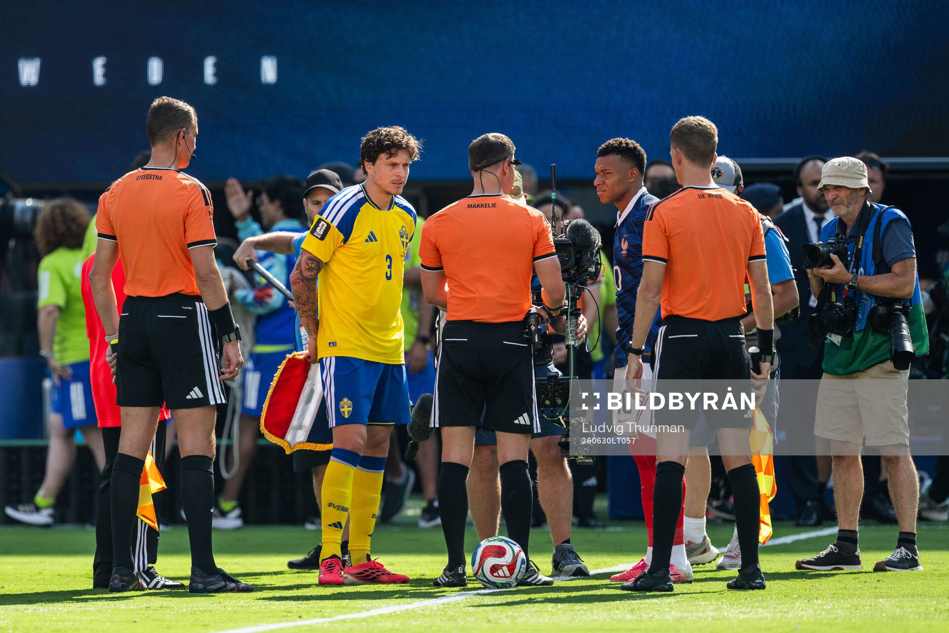 Victor Nilsson Lindelöf of Sweden and Kylian Mbappe of