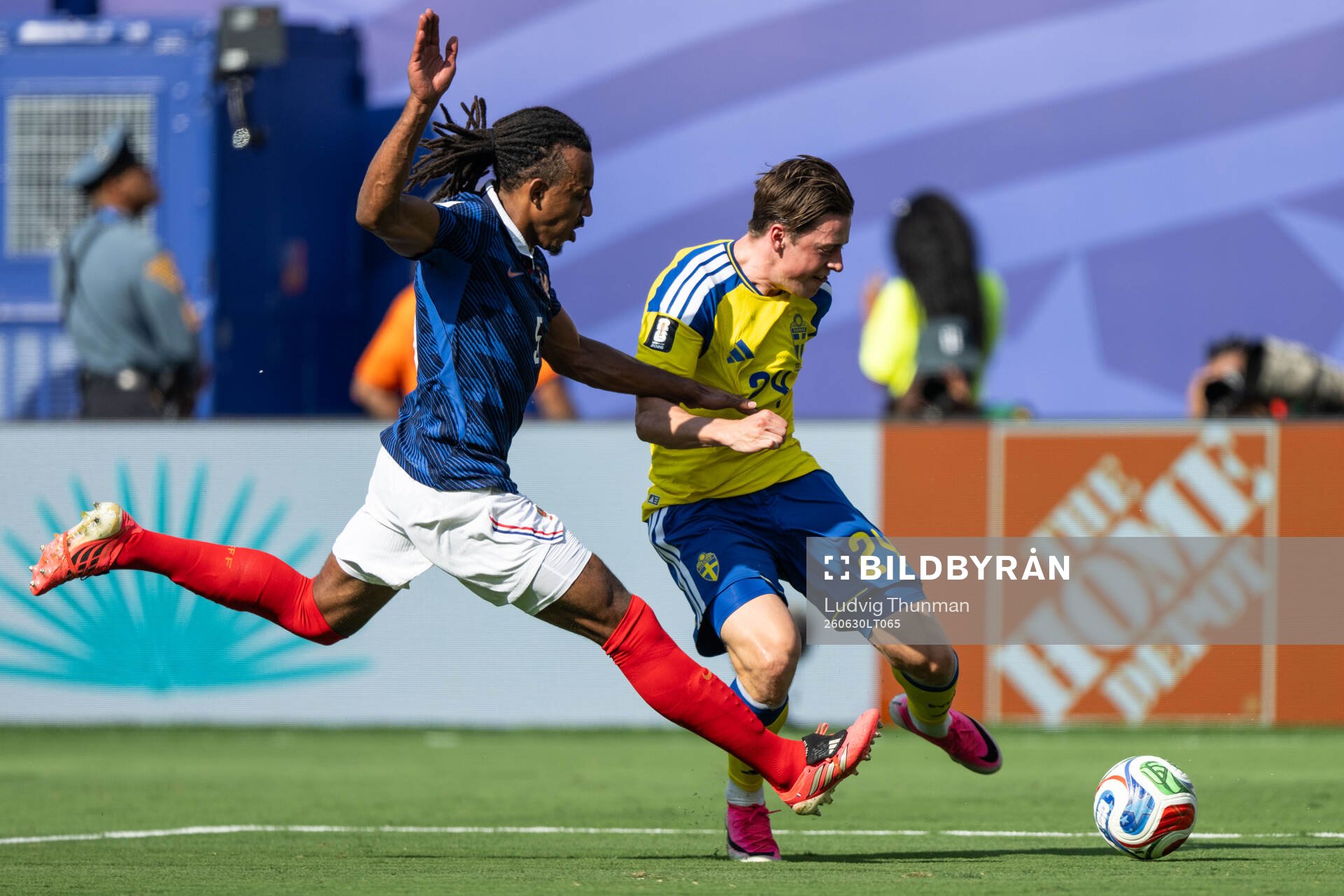 Jules Kounde of France and Elliot Stroud of Sweden