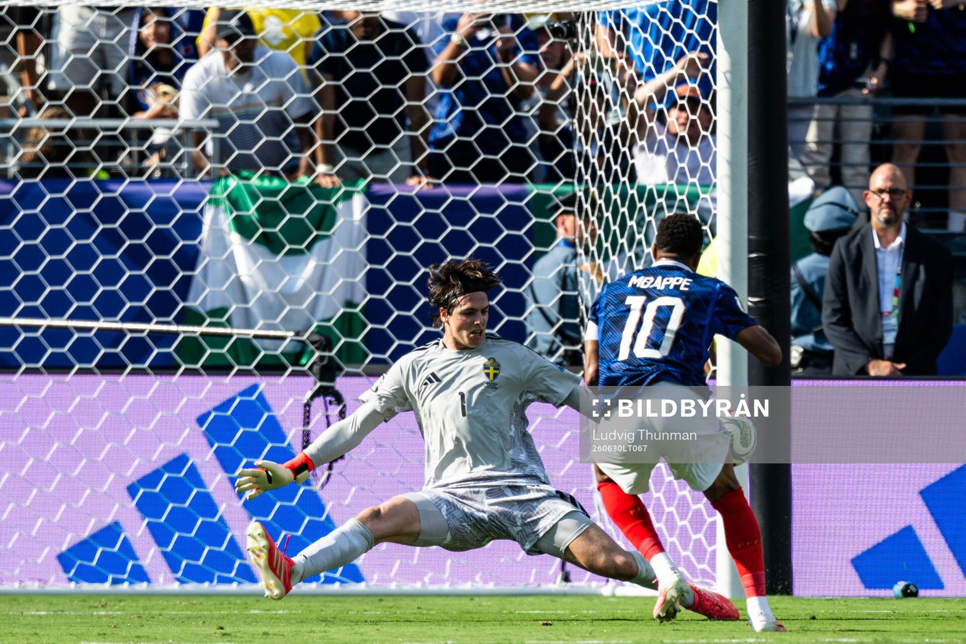 Kylian Mbappe of France and goalkeeper Jacob Widell