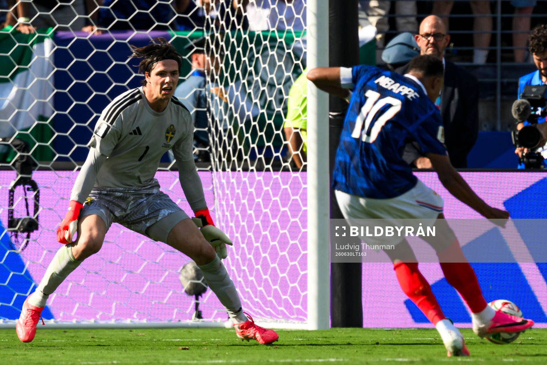 Goalkeeper Jacob Widell Zetterström of Sweden and Kylian