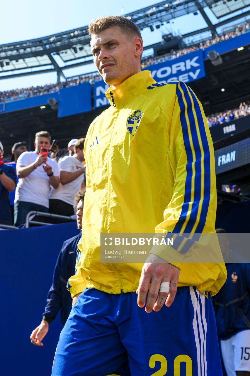 Eric Smith of Sweden enters the pitch