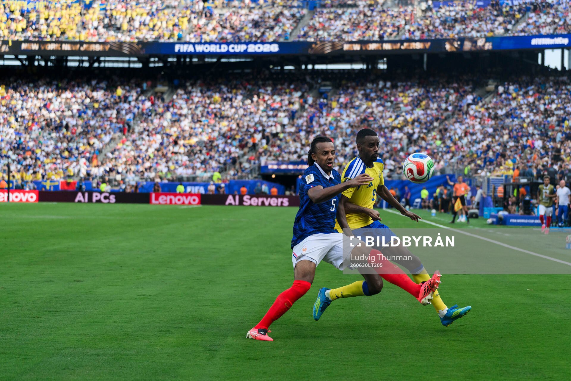 Jules Kounde of France and Alexander Isak of Sweden