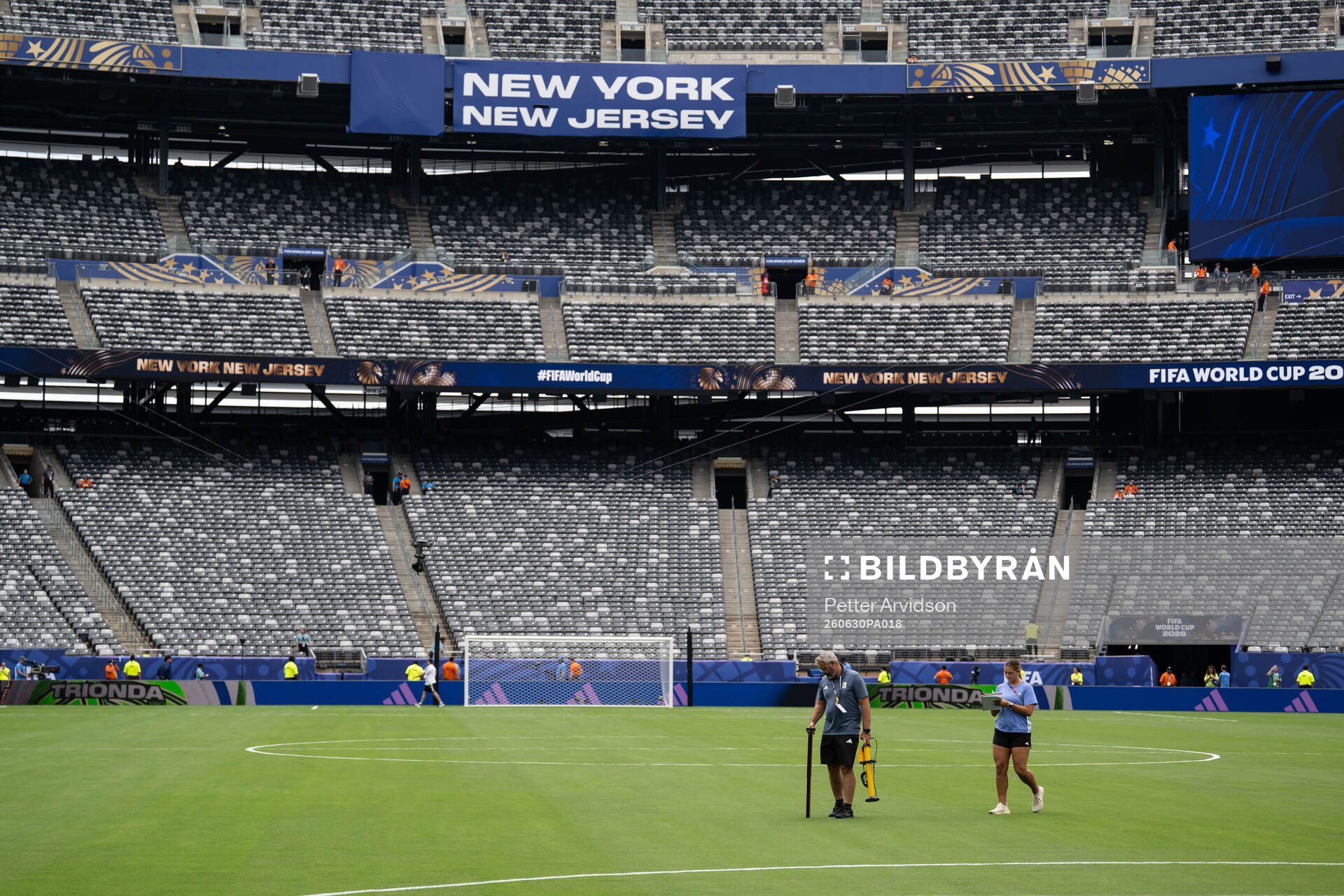 Staff observing the pitch at New York New Jersey Arena