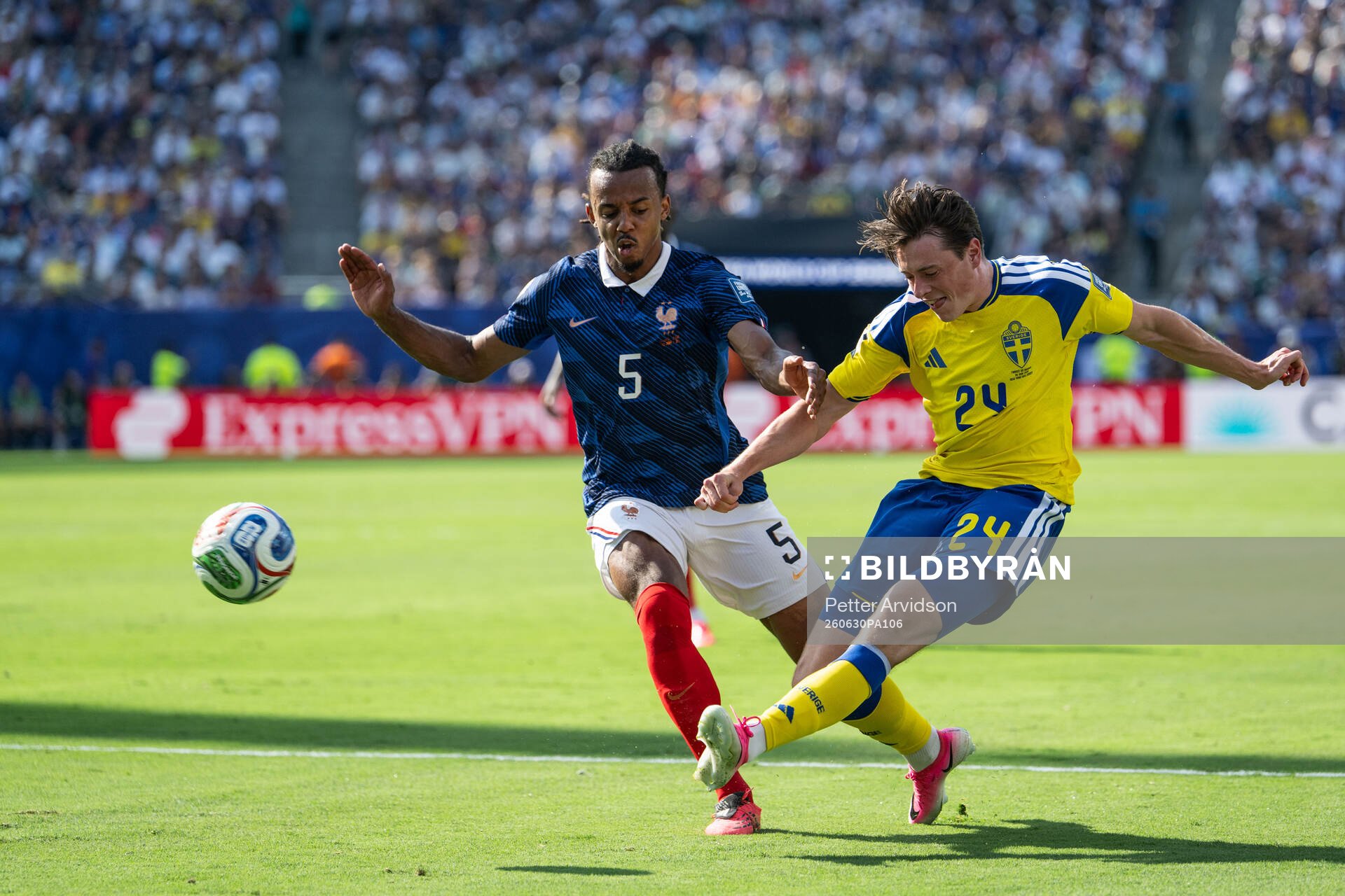 Jules Kounde of France and Elliot Stroud of Sweden