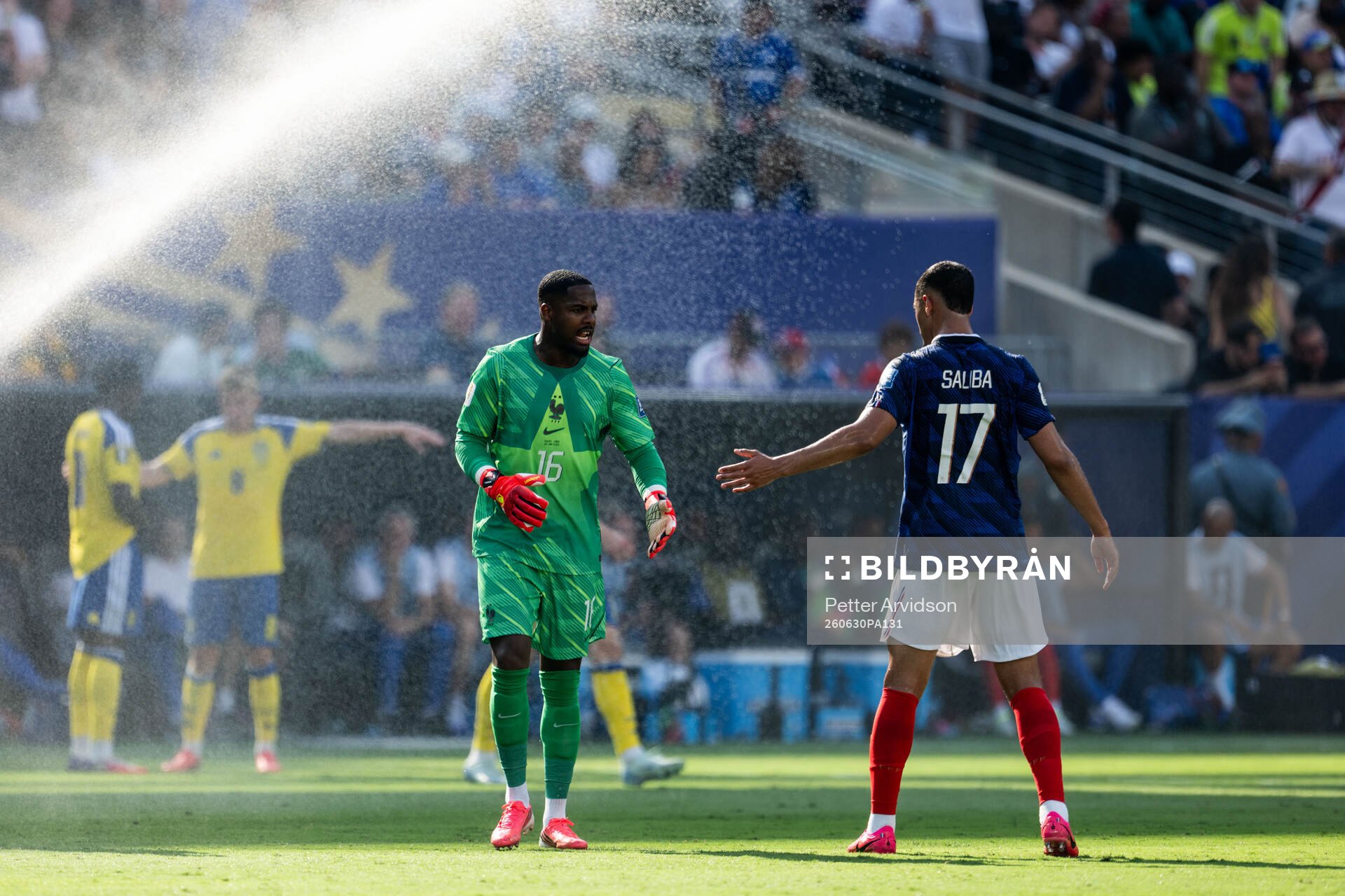 Goalkeeper Mike Maignan and William Saliba of France