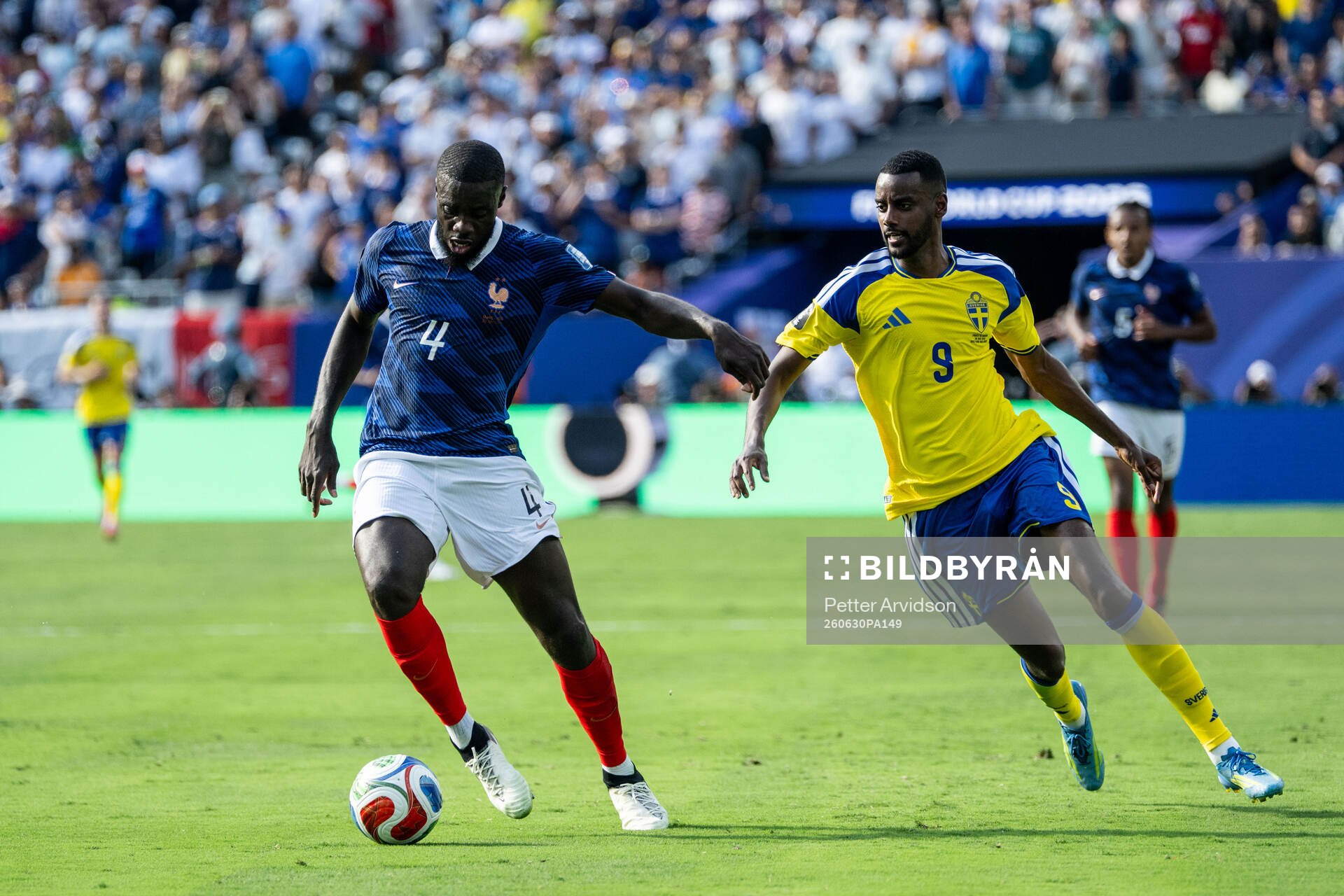 Dayot Upamecano of France and Alexander Isak of Sweden