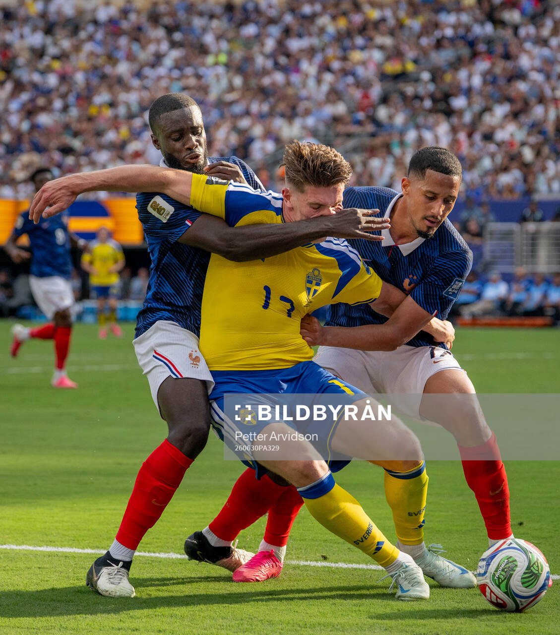 Viktor Gyökeres of Sweden in action with Dayot Upamecano
