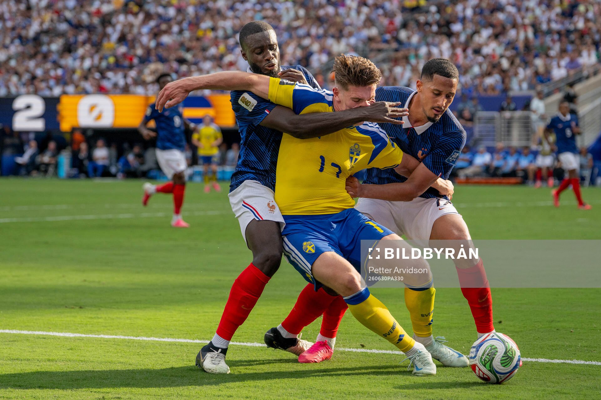Viktor Gyökeres of Sweden in action with Dayot Upamecano