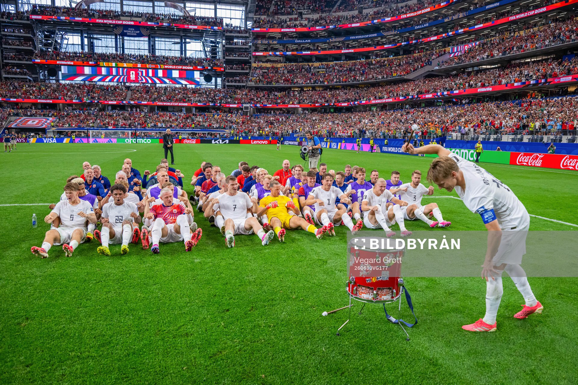 Players and staff of Norway celebrate with a viking row