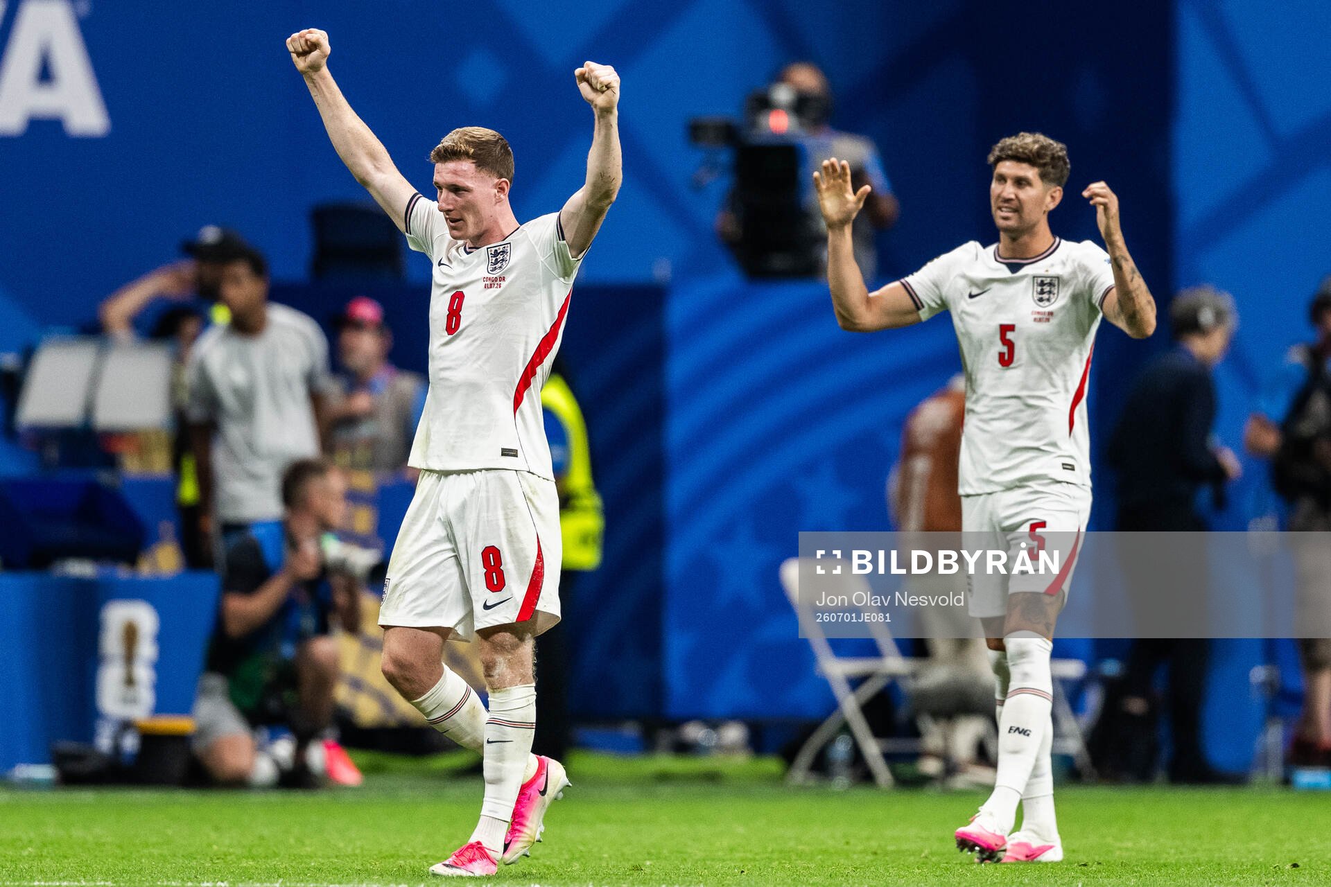 Elliot Anderson and John Stones of England celebrate