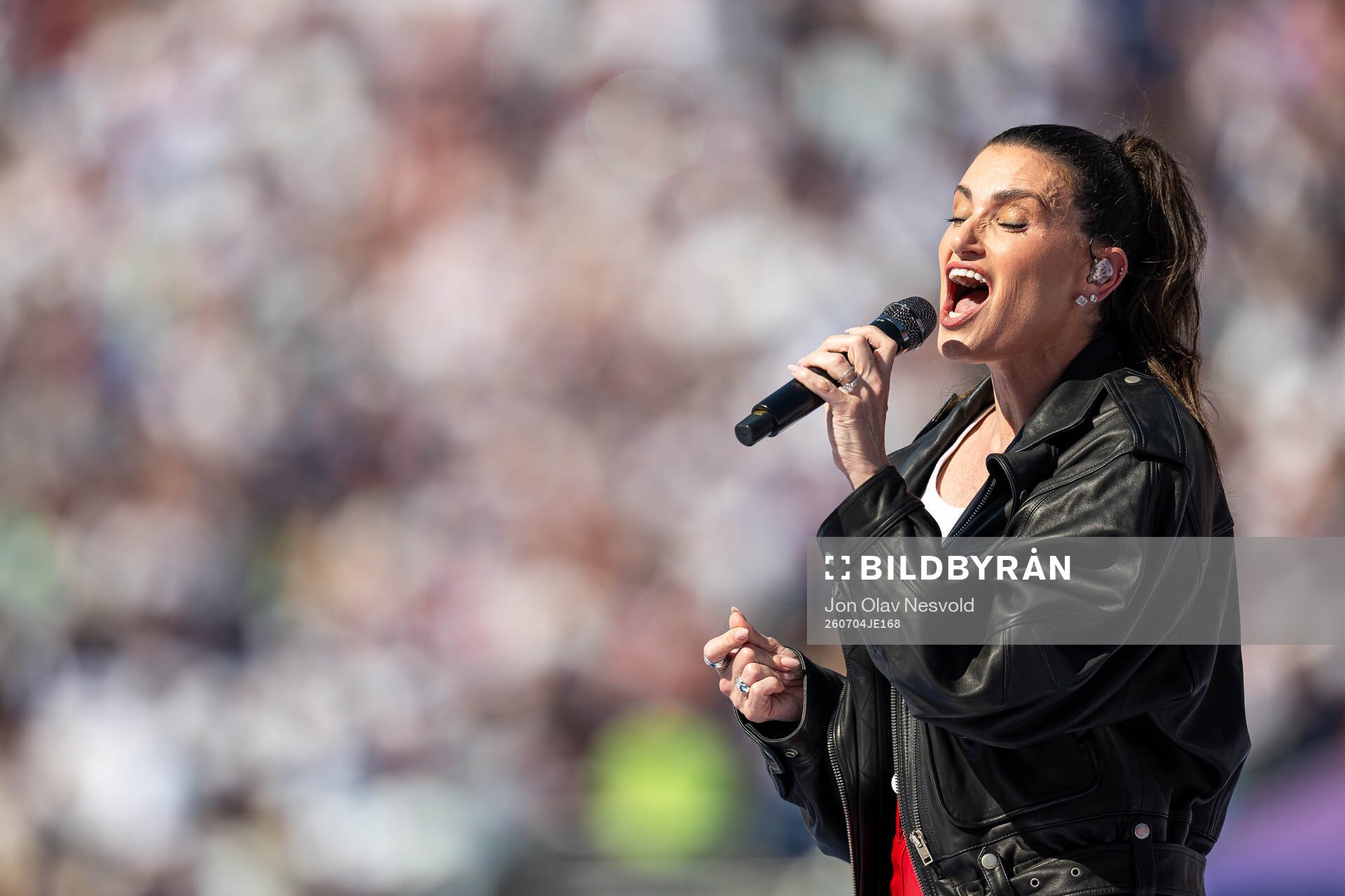 Idina Menzel, artist, sings the national anthem of the