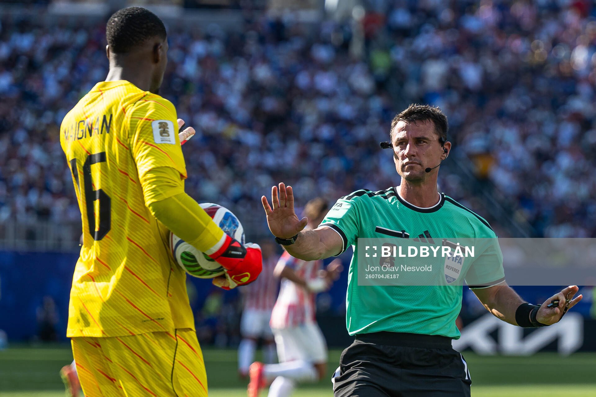 Goalkeeper Mike Maignan of France and Referee Ilgiz