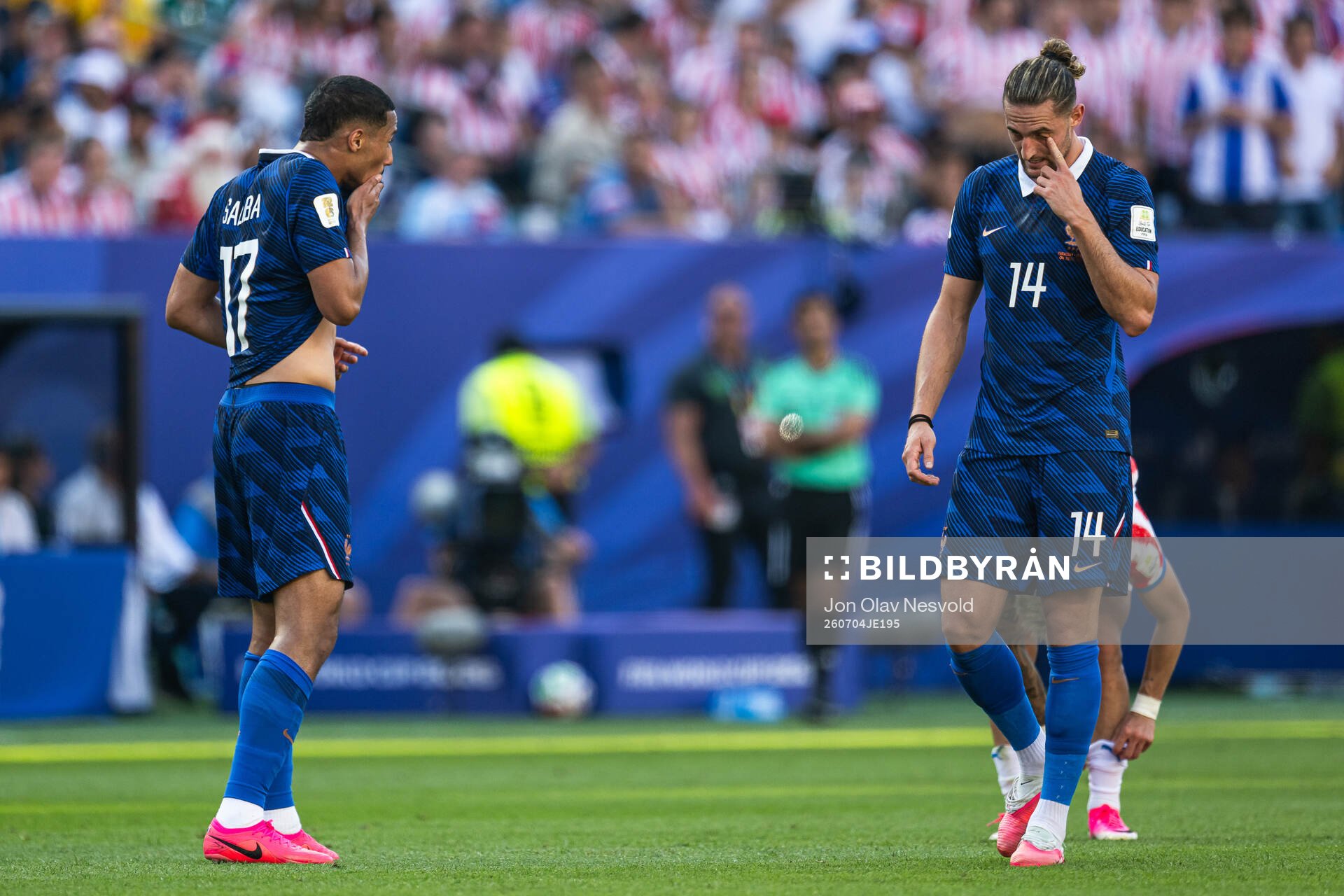 William Saliba and Adrien Rabiot of France looks dejected