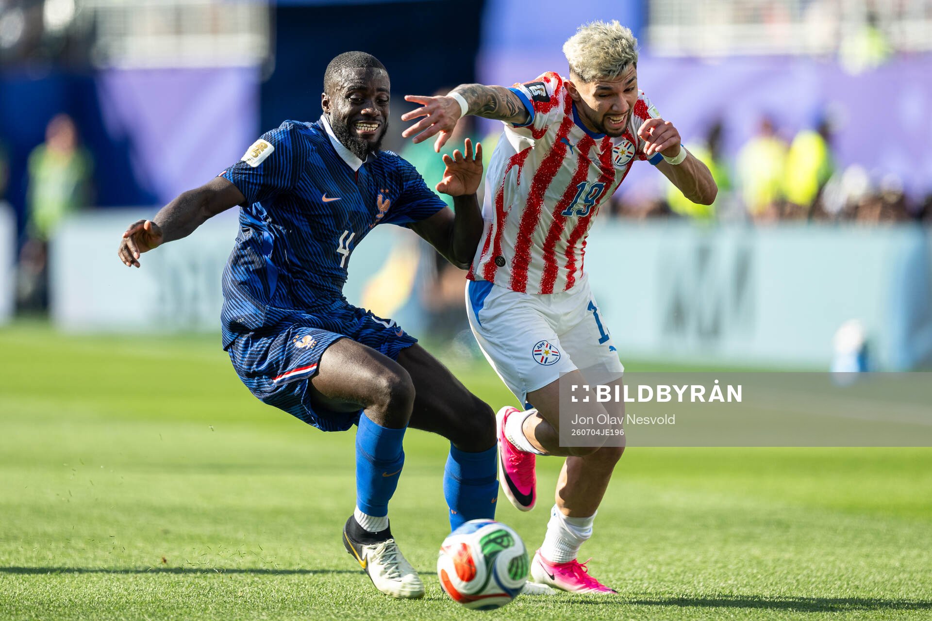 Dayot Upamecano of France and Julio Enciso of Paraguay