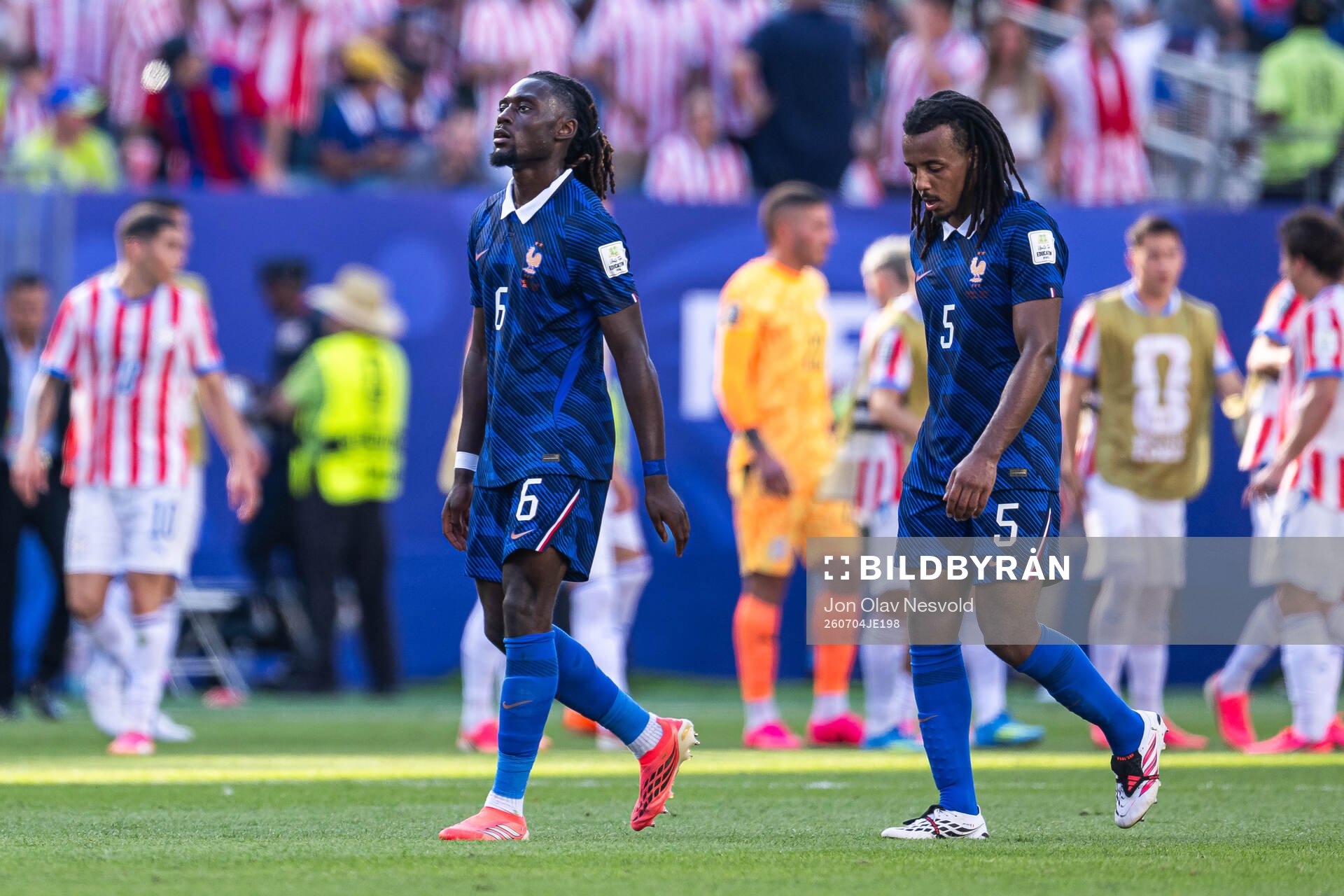 Manu Kone and Jules Kounde of France look dejected