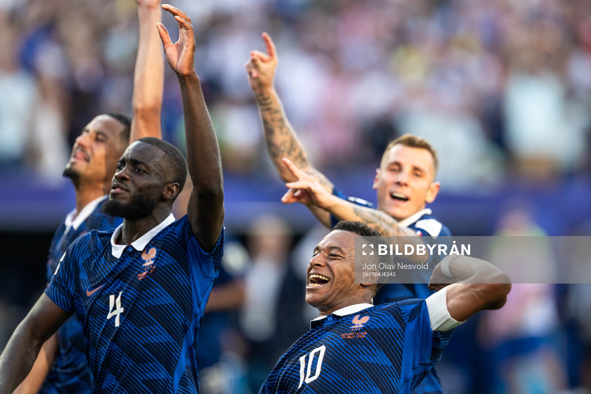 Dayot Upamecano and Kylian Mbappe of France celebrate