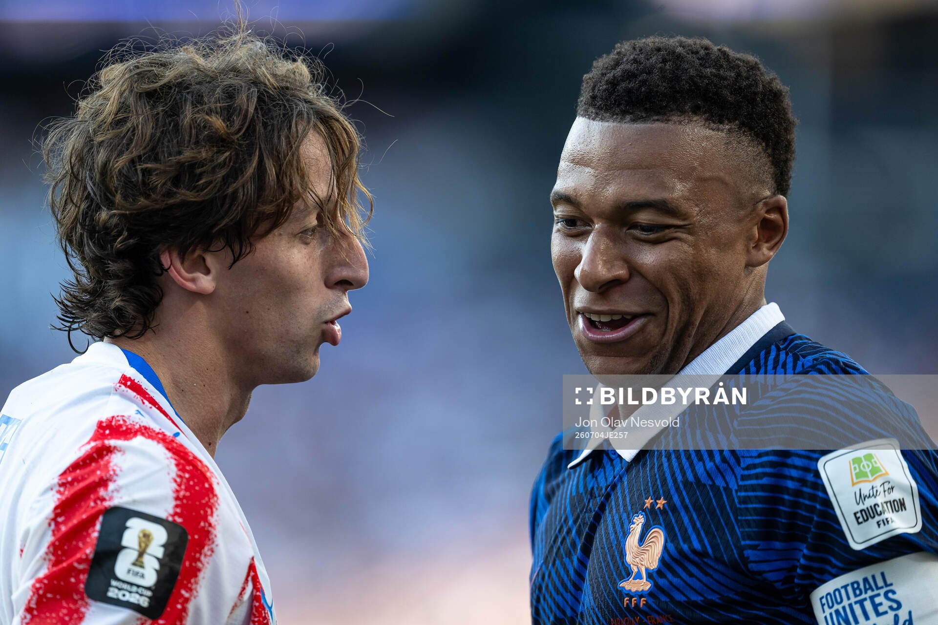 Matias Galarza of Paraguay and Kylian Mbappe of France