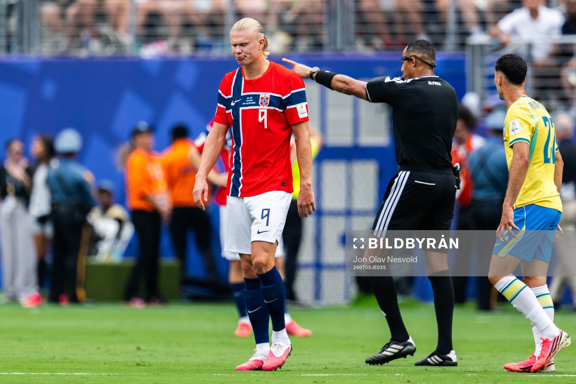 Erling Braut Haaland of Norway and referee Ismail Elfath