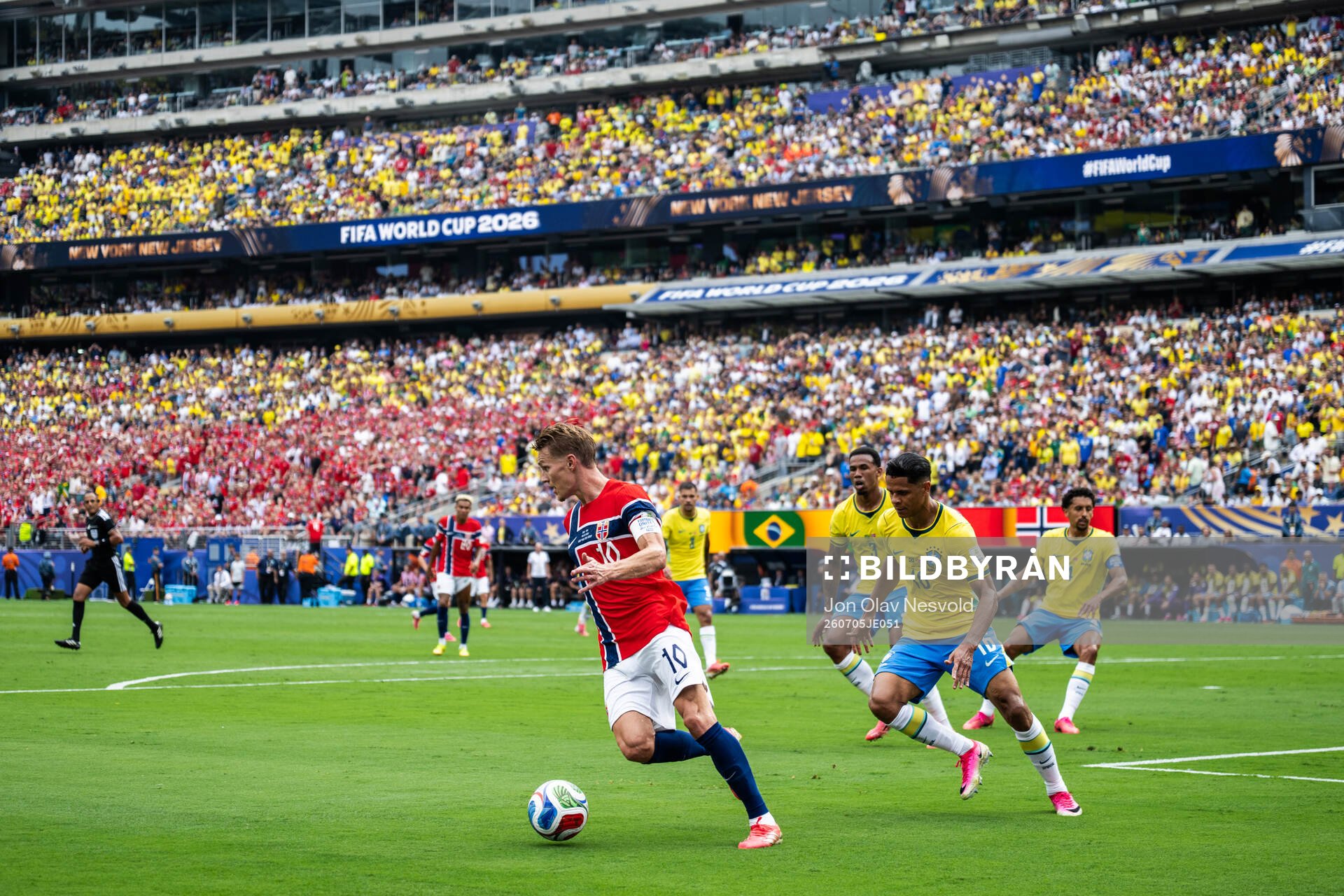 Martin Ødegaard of Norway and Douglas Santos of Brazil