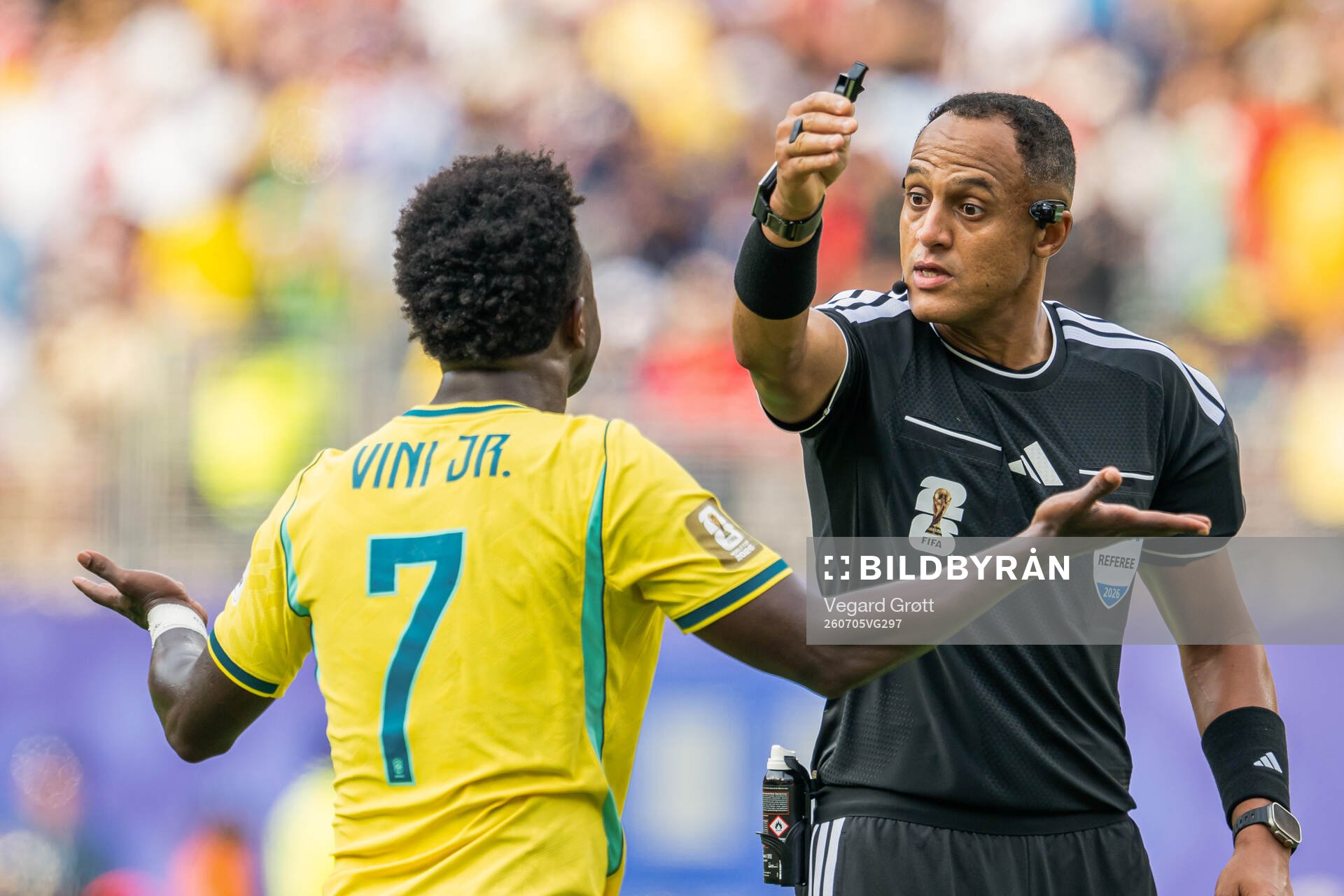Vinicius Junior of Brazil and referee Ismail Elfath