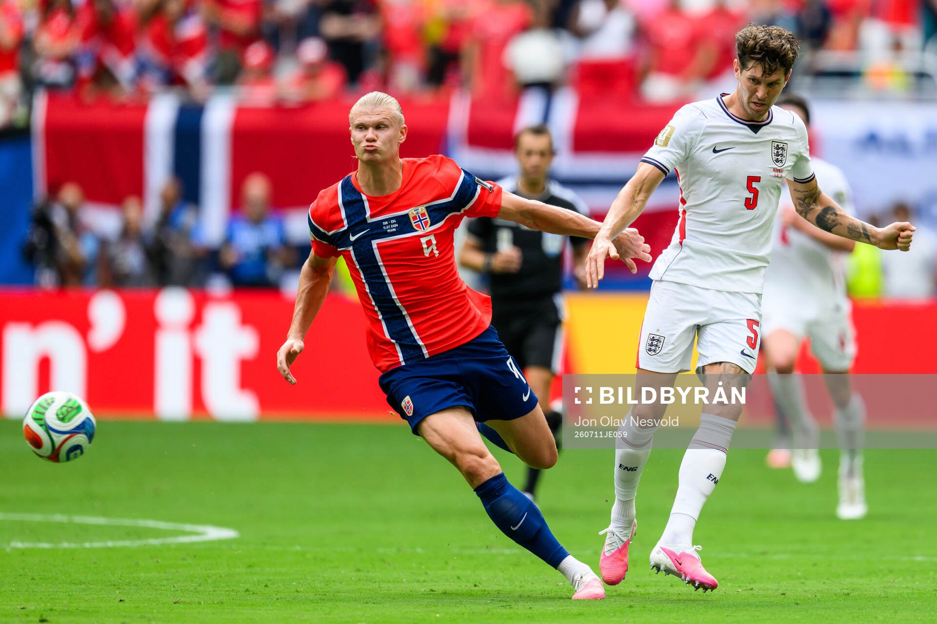 Erling Braut Haaland of Norway and John Stones of England