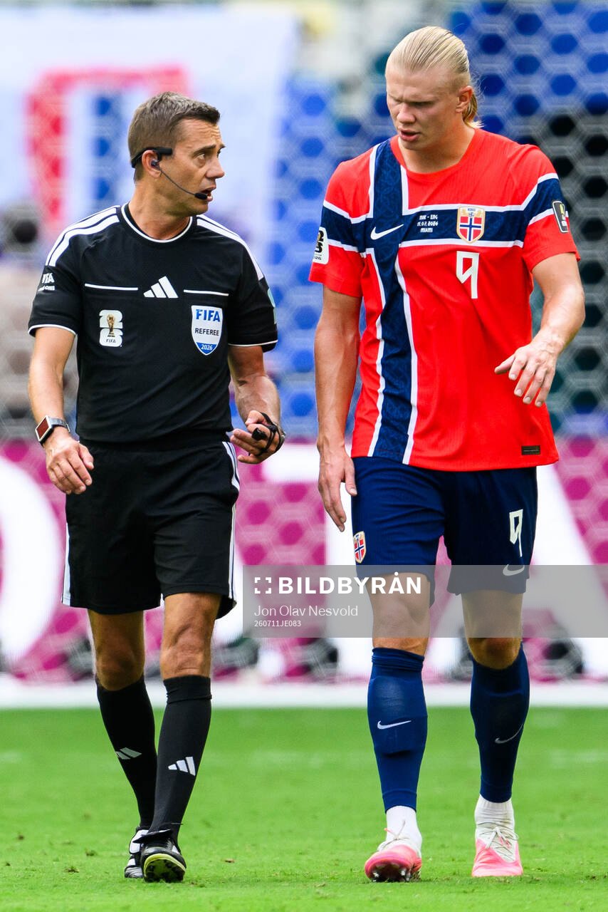 Referee Clément Turpin and Erling Braut Haaland of Norway