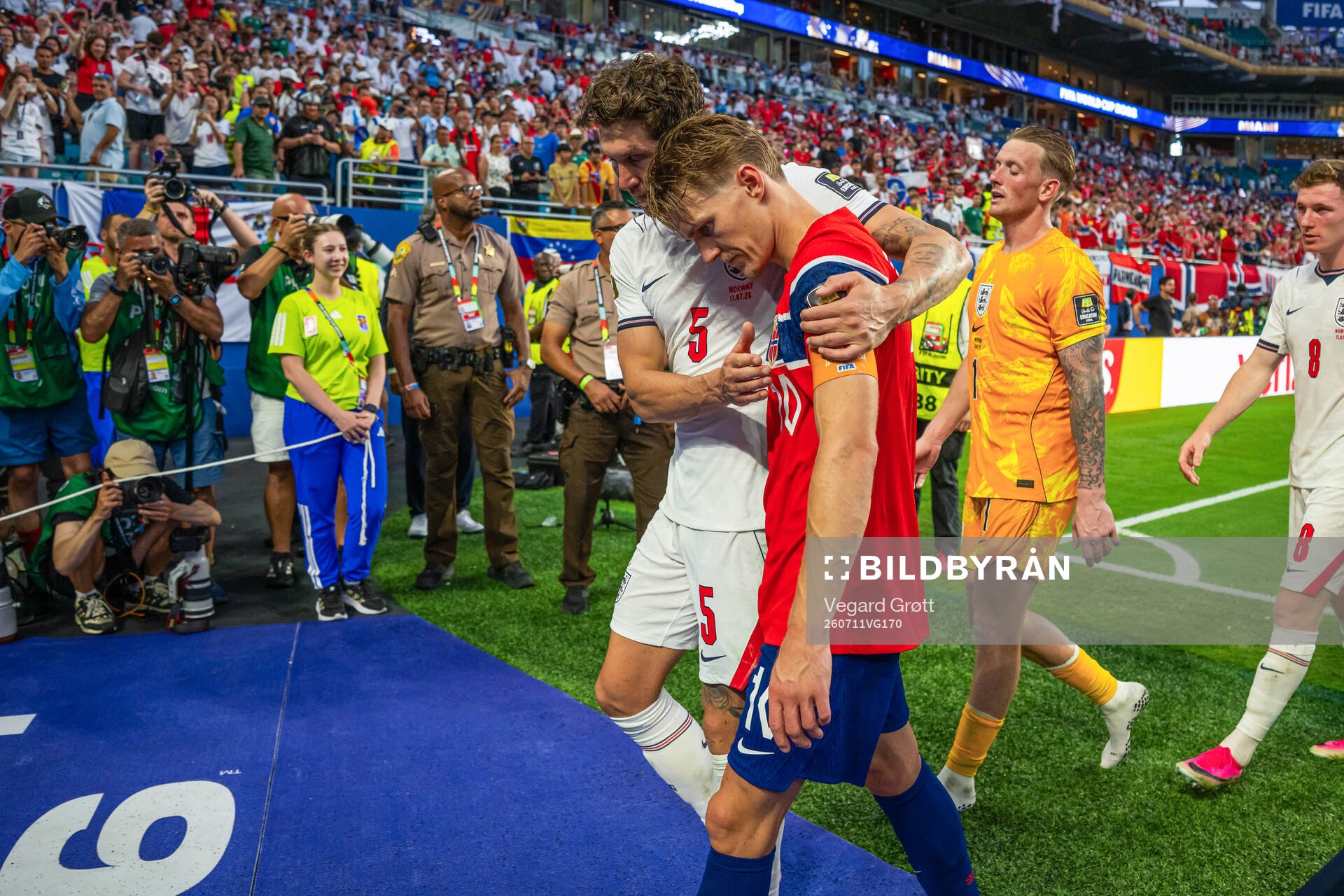 John Stones of England and Martin Ødegaard of Norway