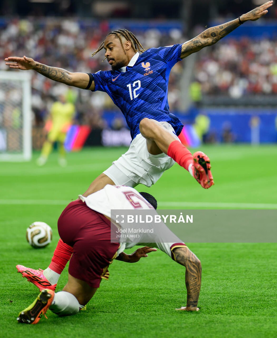 Pedro Porro of Spain and Bradley Barcola of France