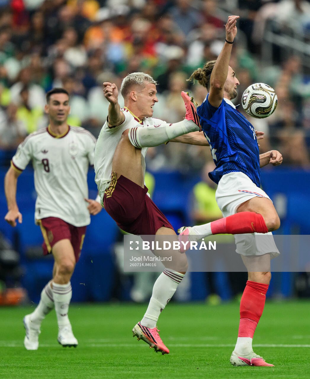 Dani Olmo of Spain and Adrien Rabiot of France