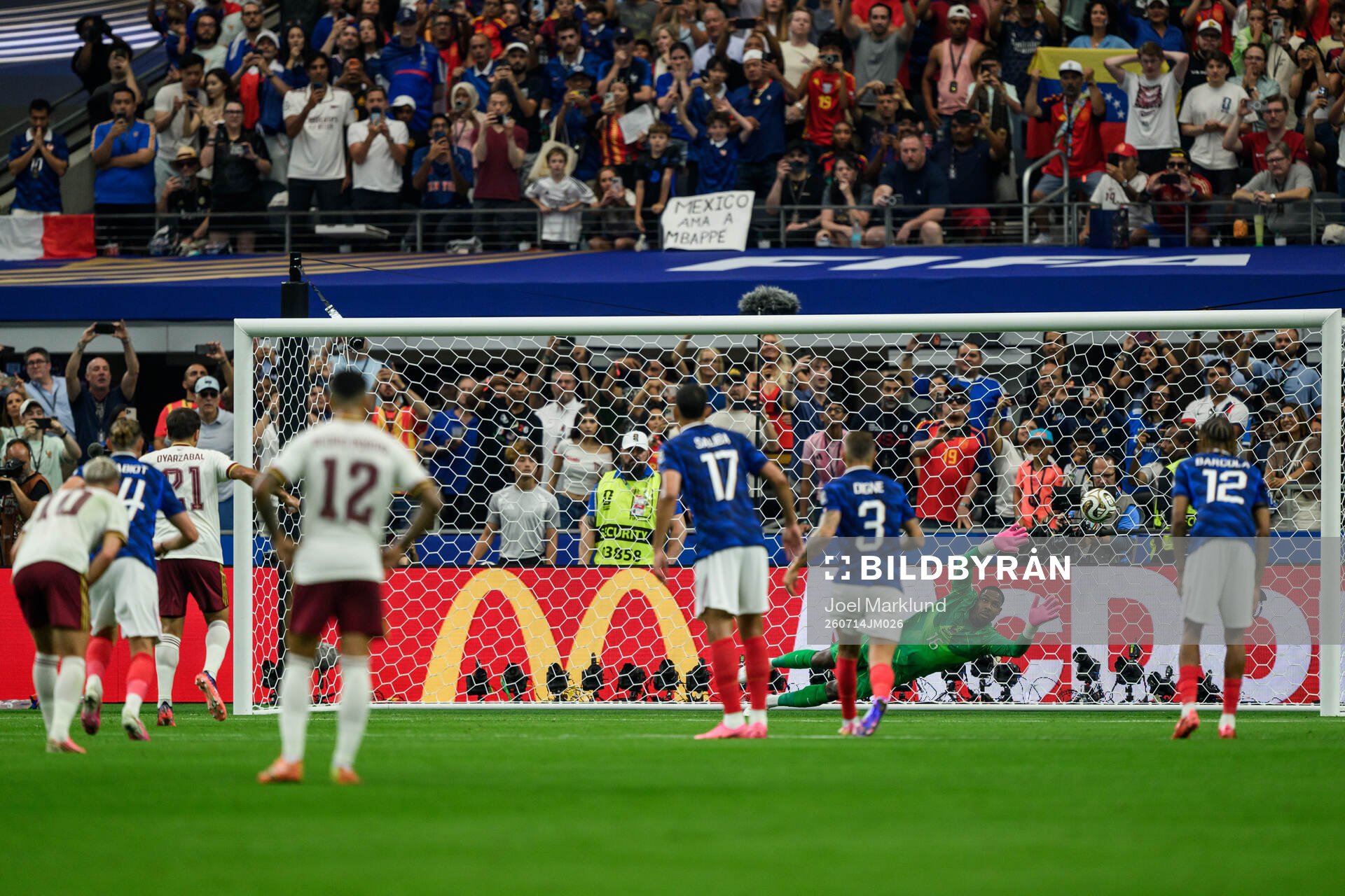 goalkeeper Mike Maignan of France concedes a penalty kick