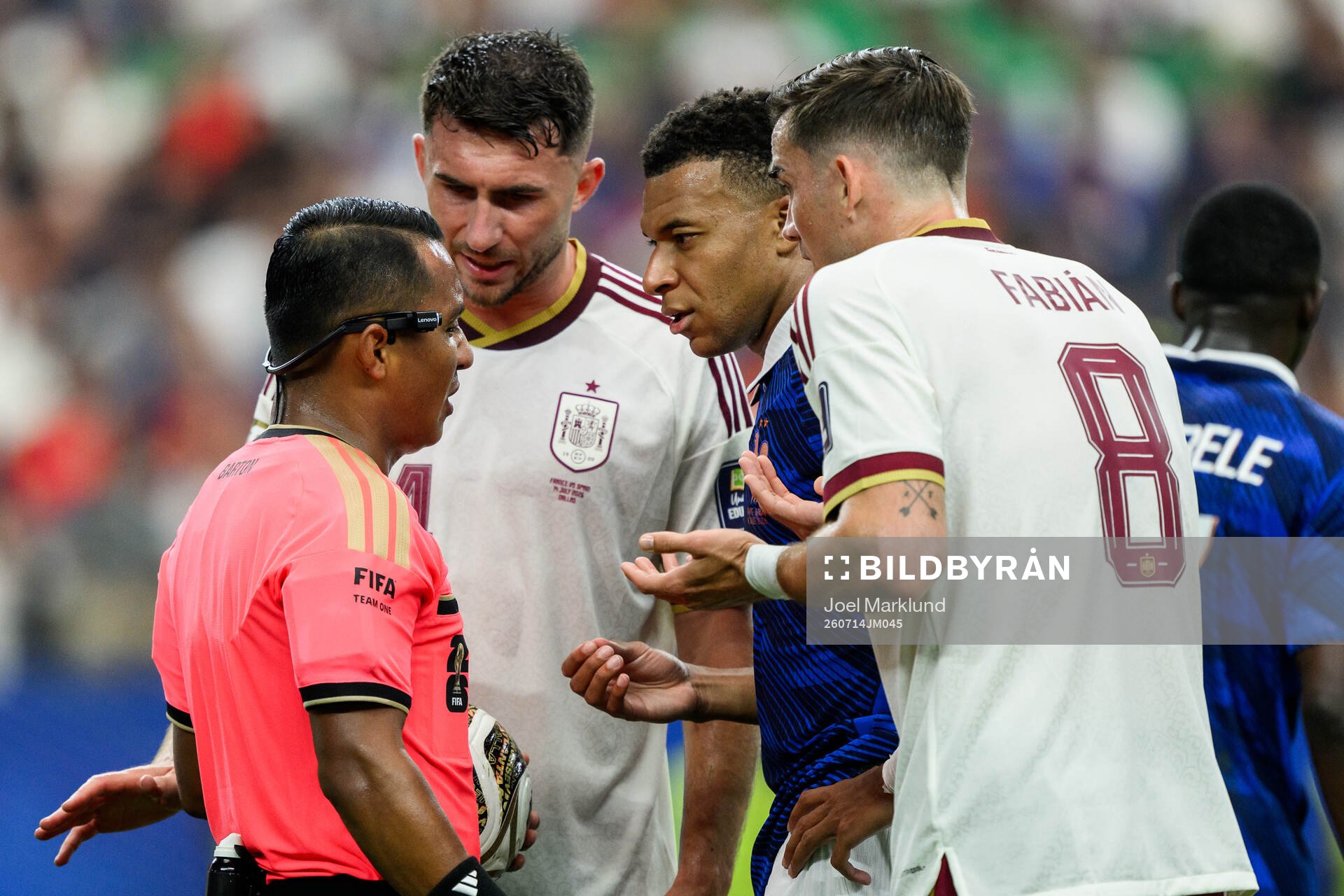 Aymeric Laporte and Fabian Ruiz of Spain, Kylian Mbappe of