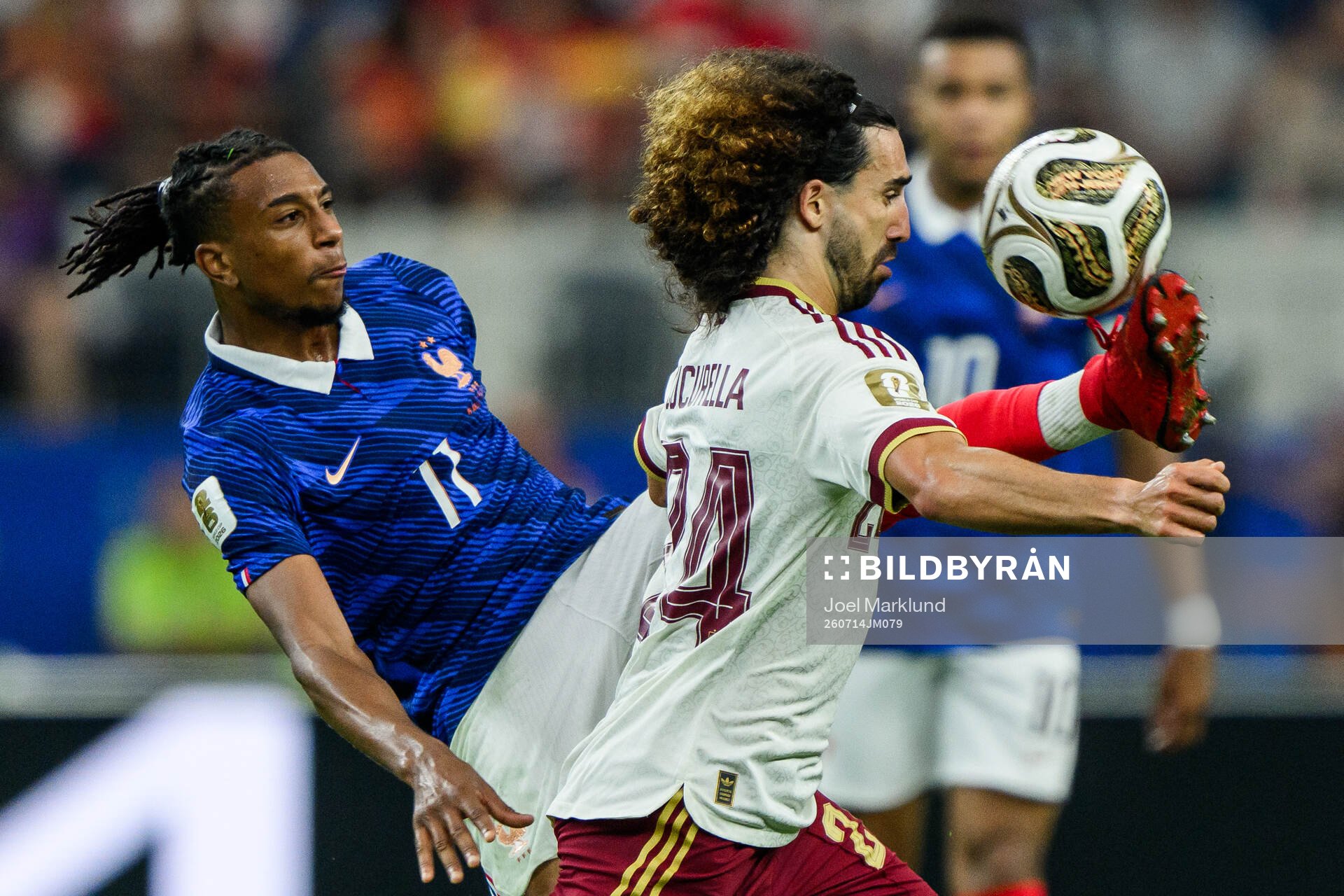 Michael Olise of France and Marc Cucurella of Spain