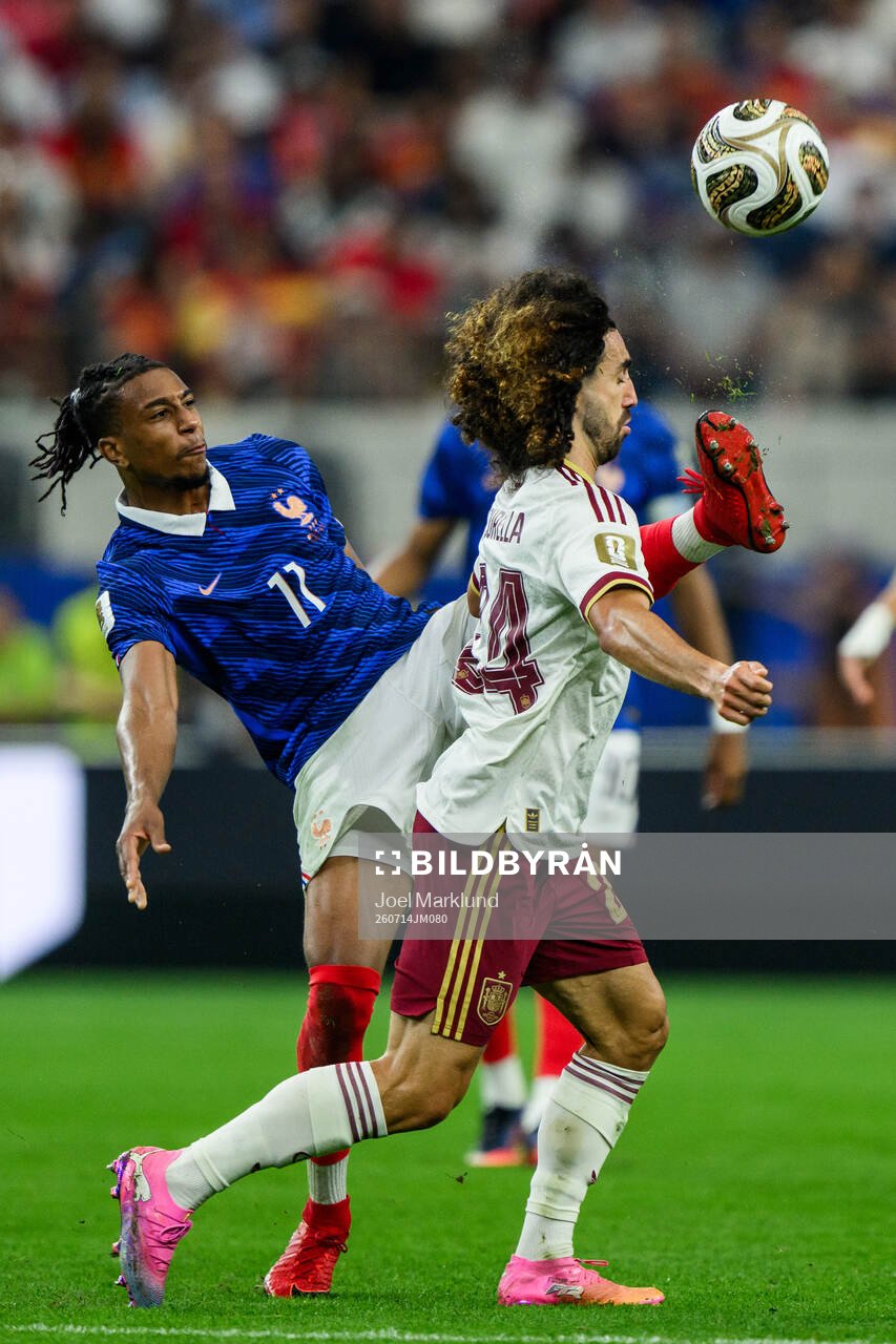 Michael Olise of France and Marc Cucurella of Spain