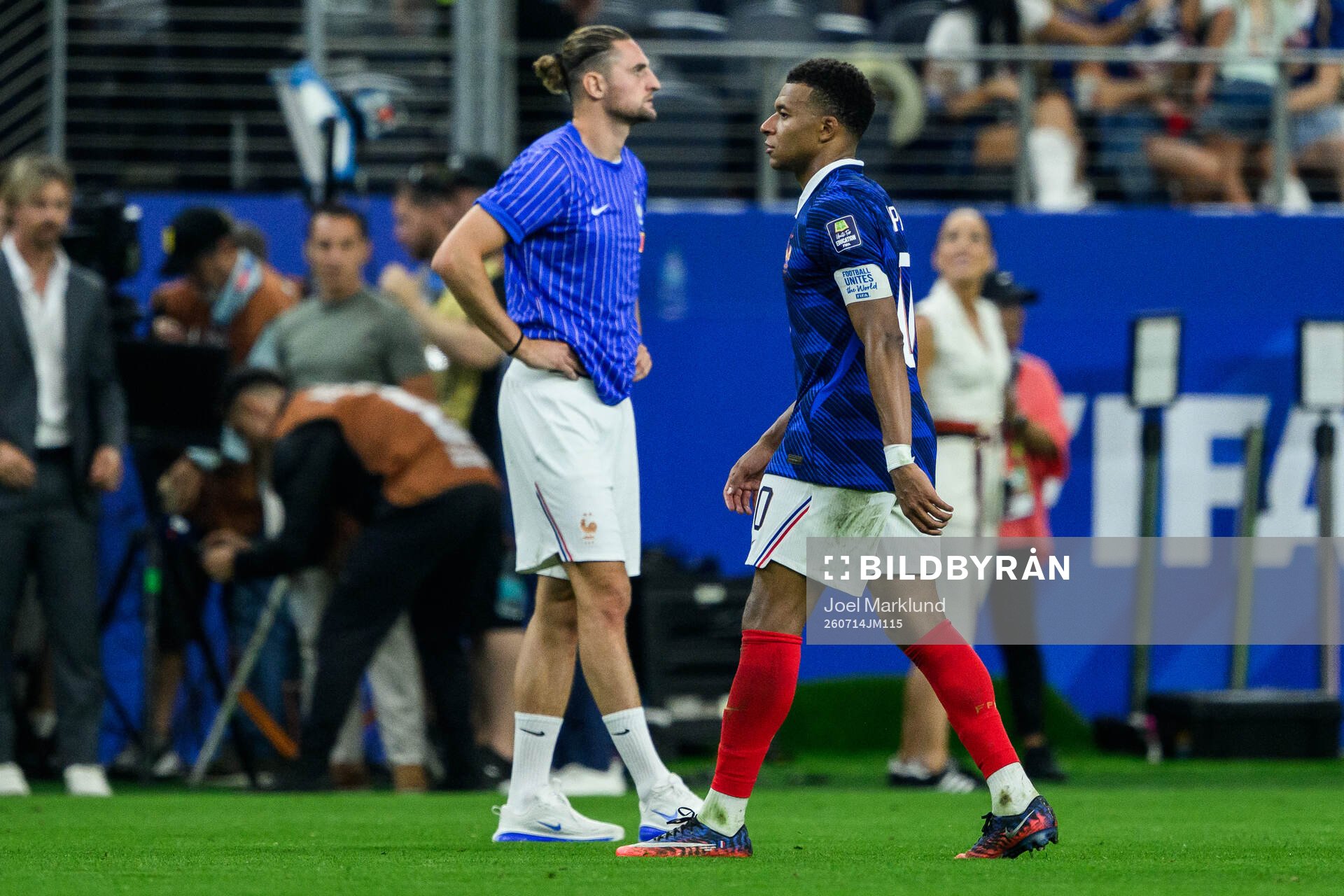 Adrien Rabiot and Kylian Mbappe of France look dejected