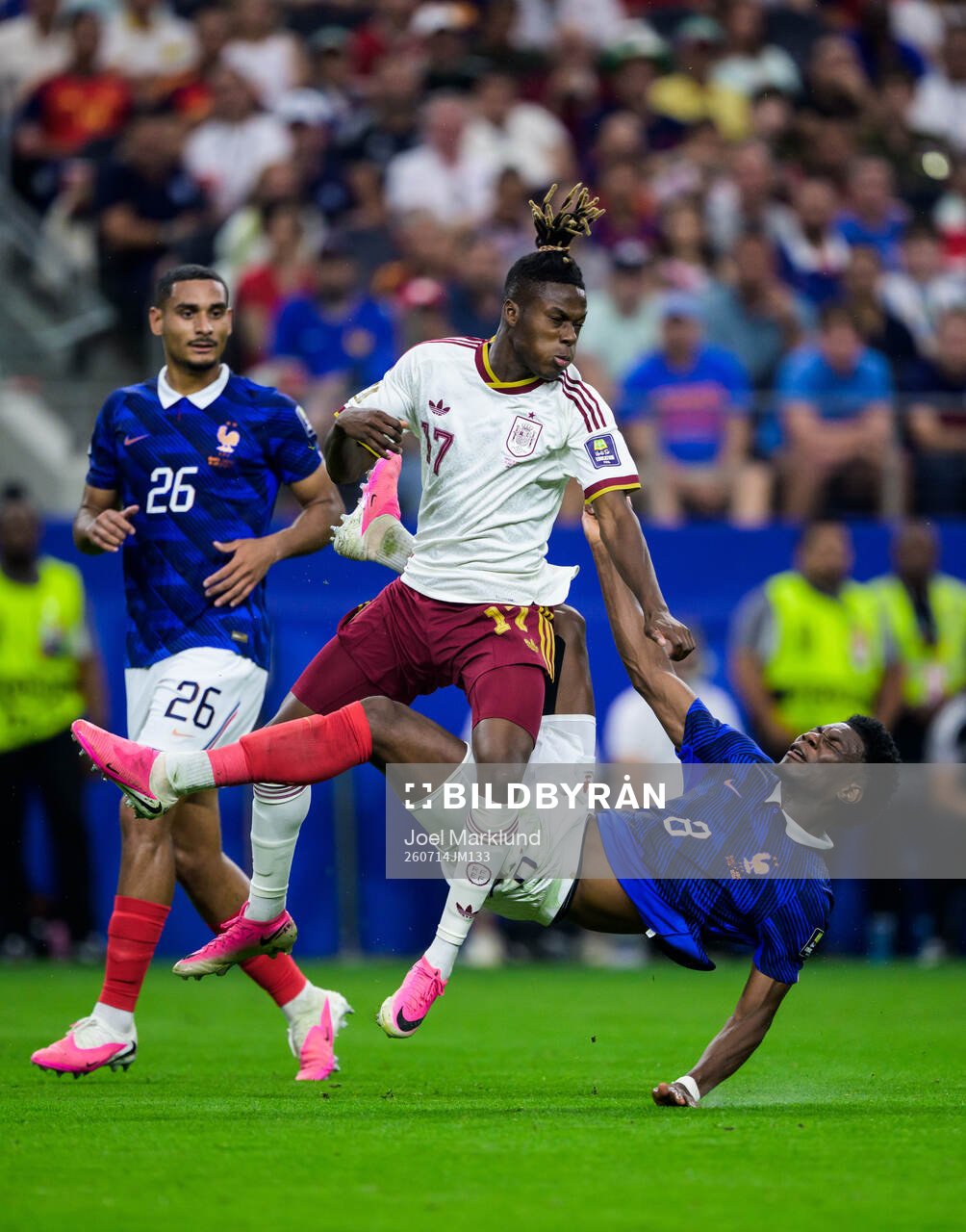 Nico Williams of Spain challenges Maxence Lacroix and