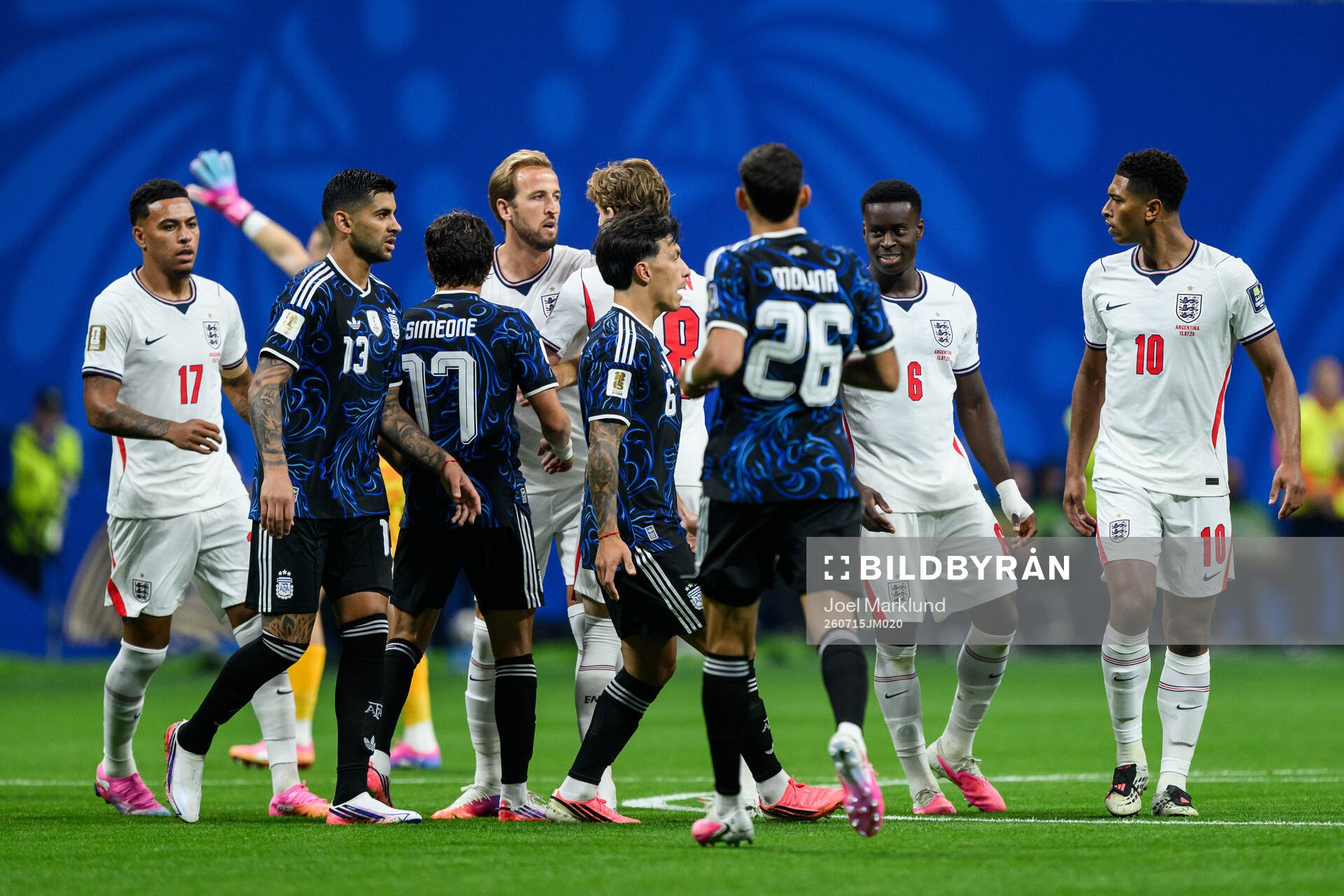 Harry Kane of England and Giuliano Simeone of Argentina