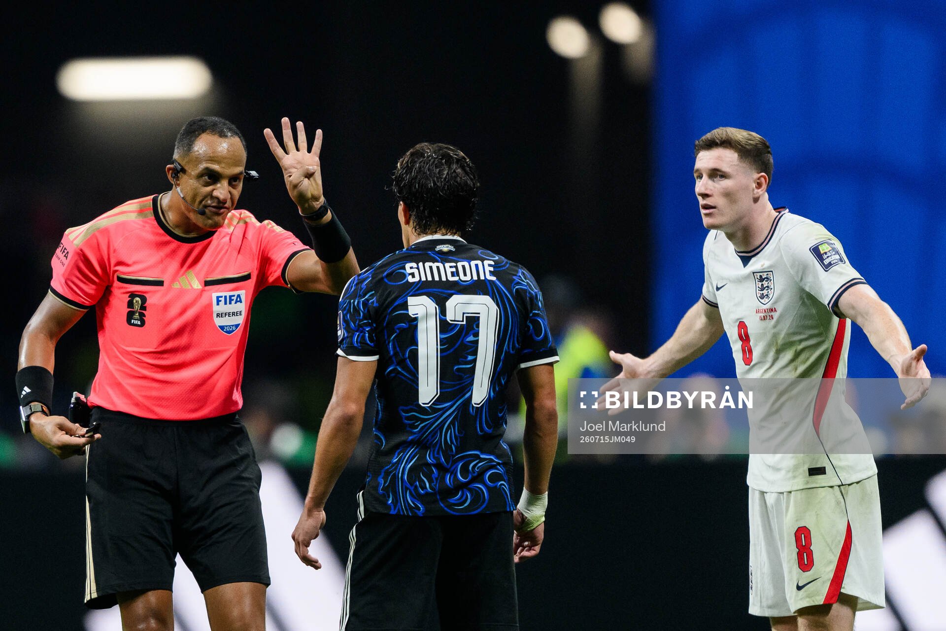 Referee Ismail Elfath and Giuliano Simeone of Argentina