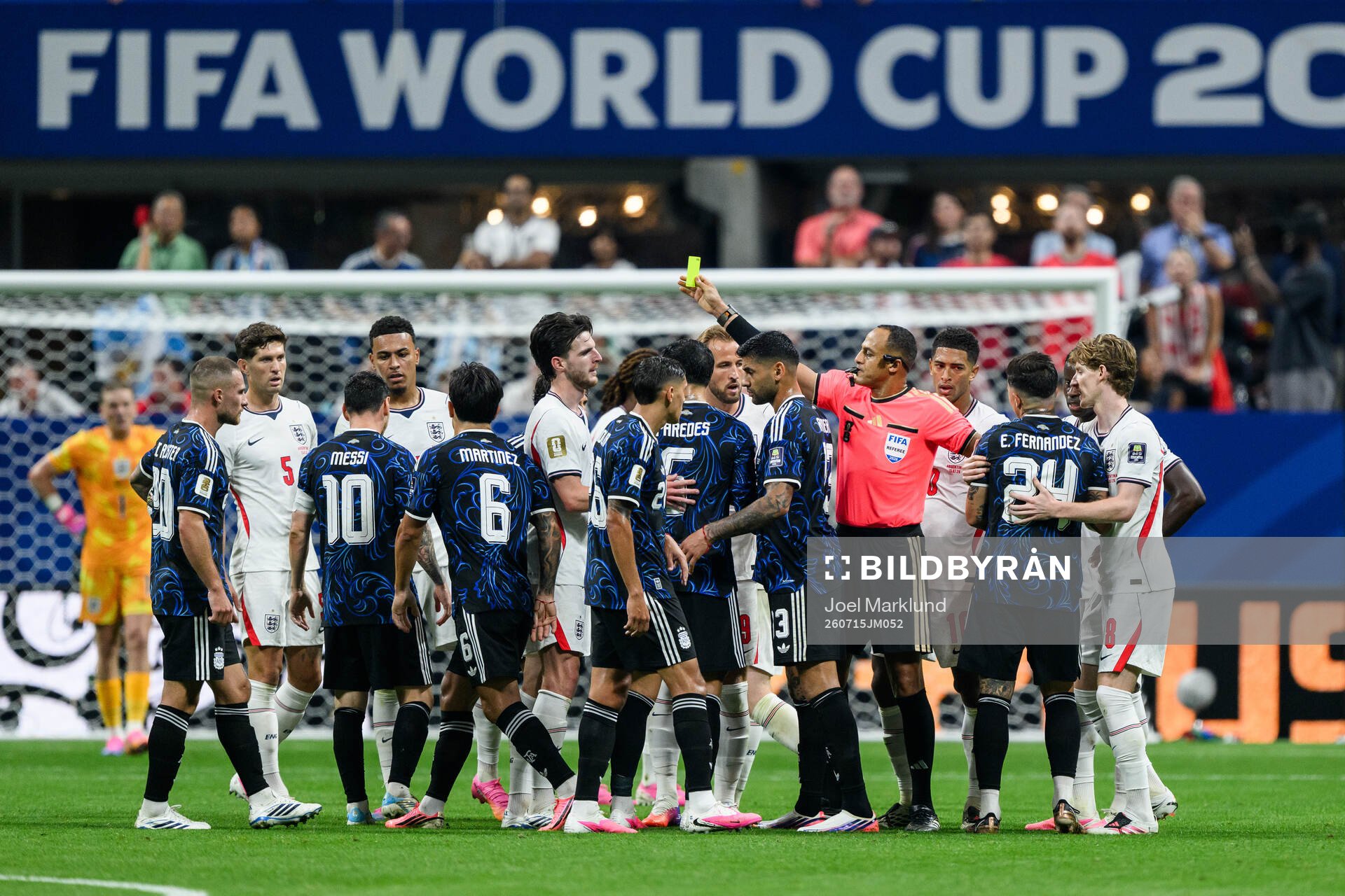 Referee Ismail Elfath and players of England and of