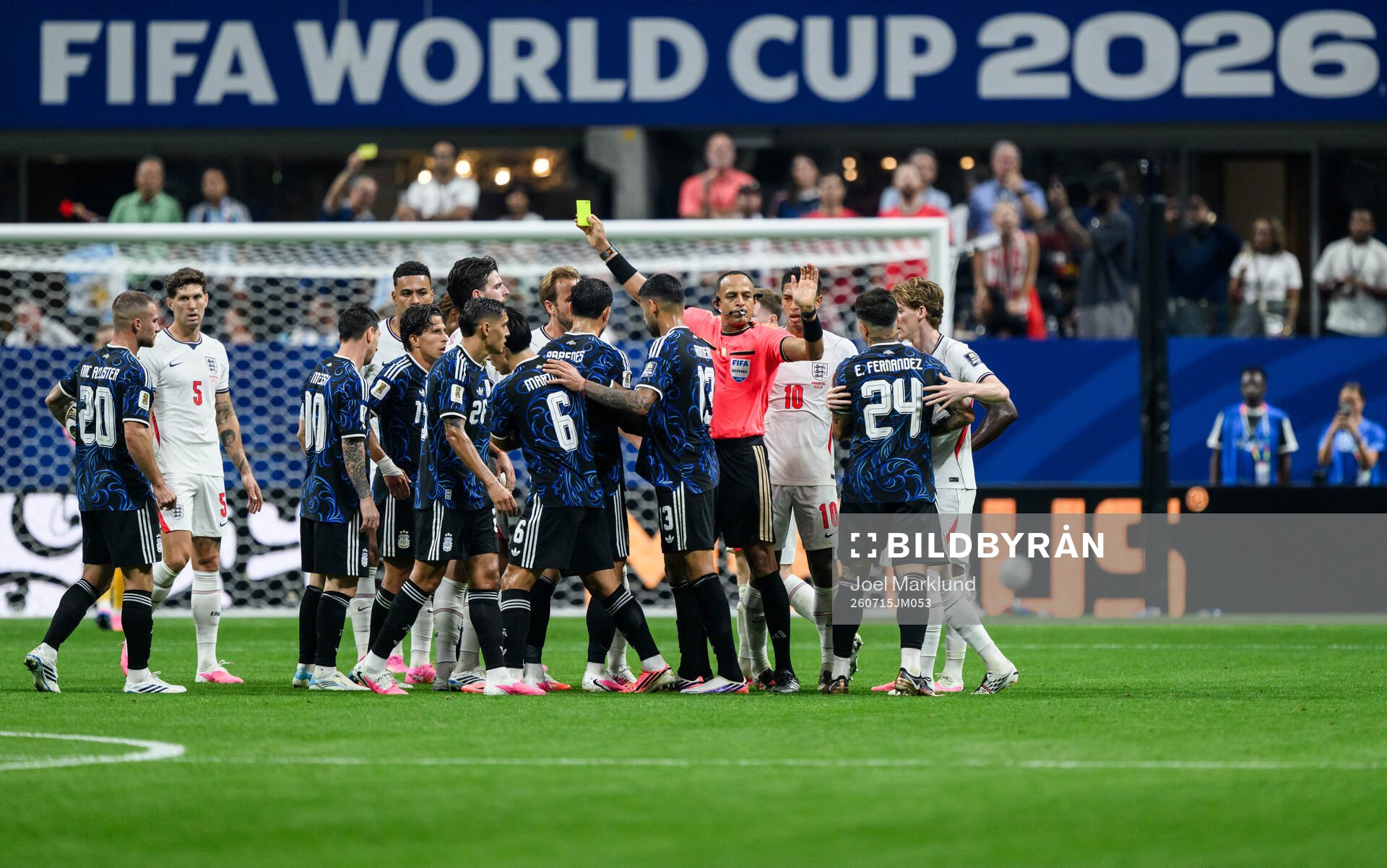 Referee Ismail Elfath and players of England and of