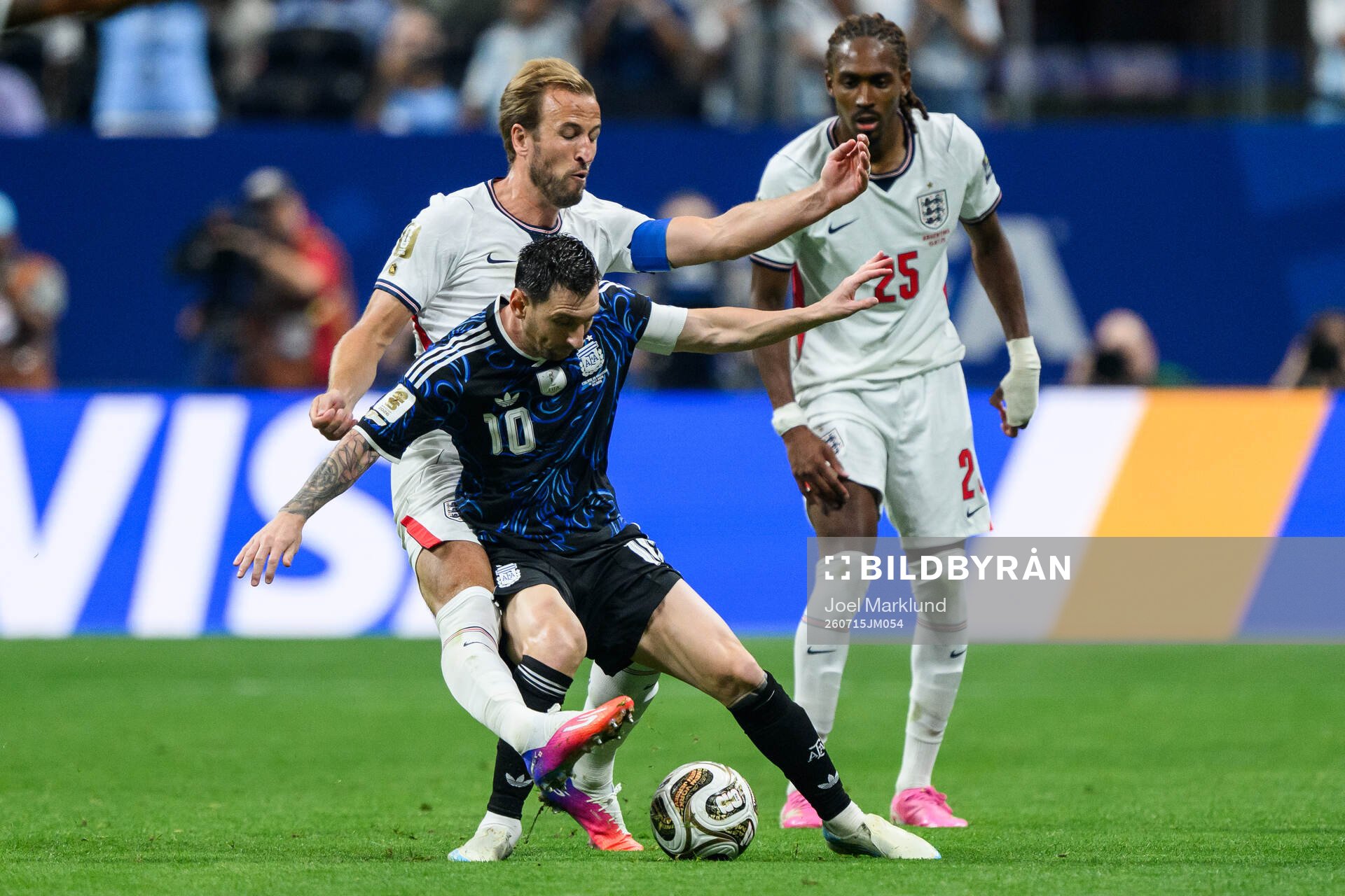 Harry Kane and Djed Spence of England against Lionel Messi