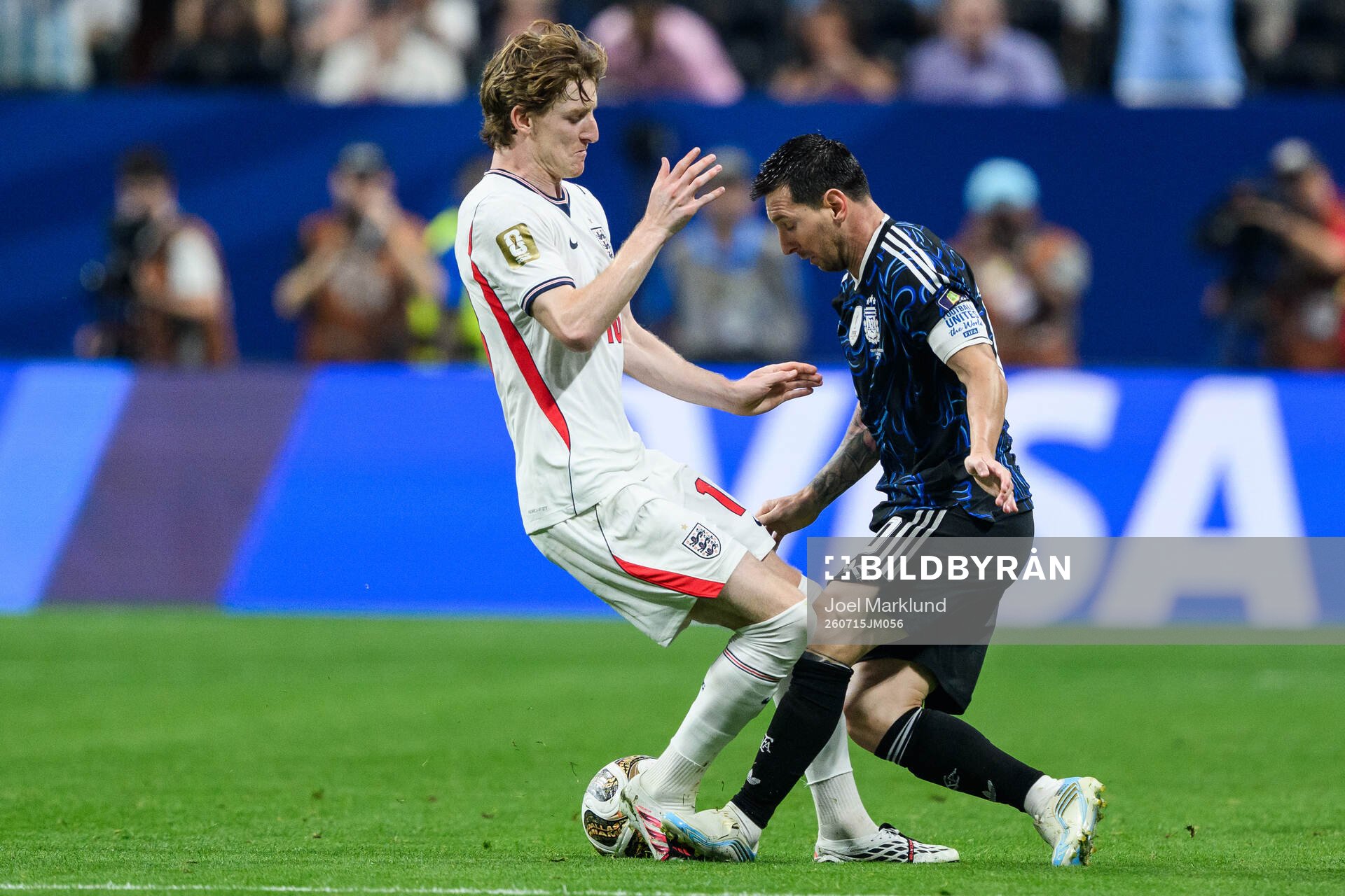 Anthony Gordon of England and Lionel Messi of Argentina