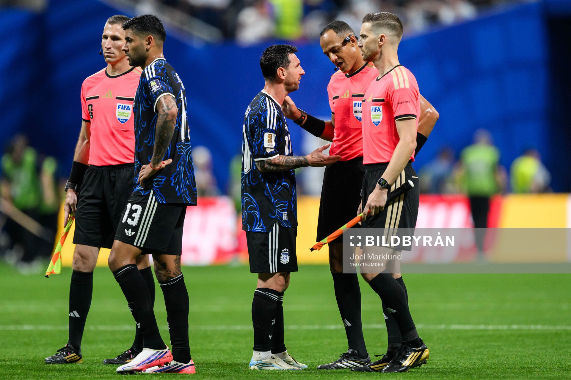 Lionel Messi of Argentina and Referee Ismail Elfath