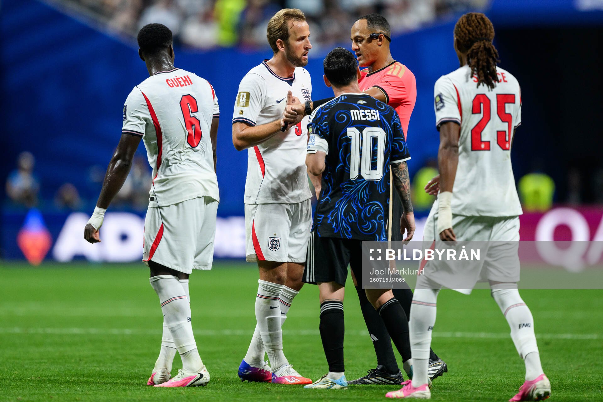 Harry Kane of England and Lionel Messi of Argentina with