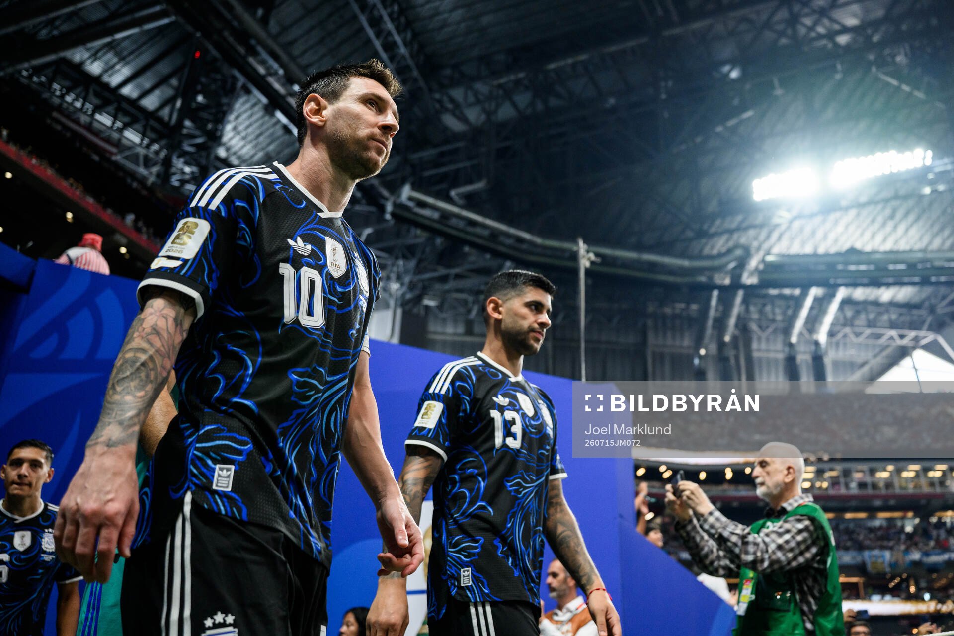 Lionel Messi and Cristian Romero of Argentina