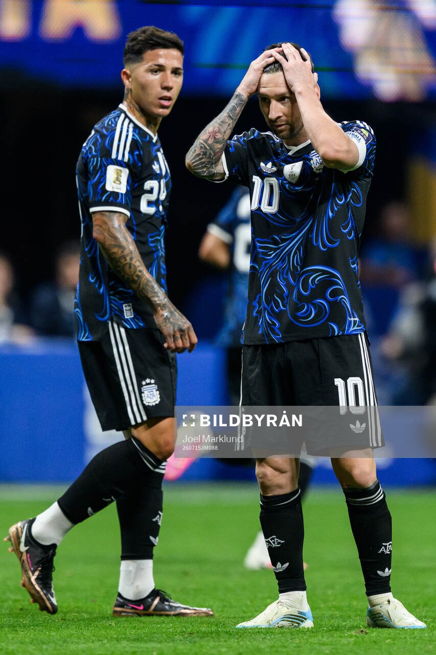 Enzo Fernandez and Lionel Messi of Argentina look dejected