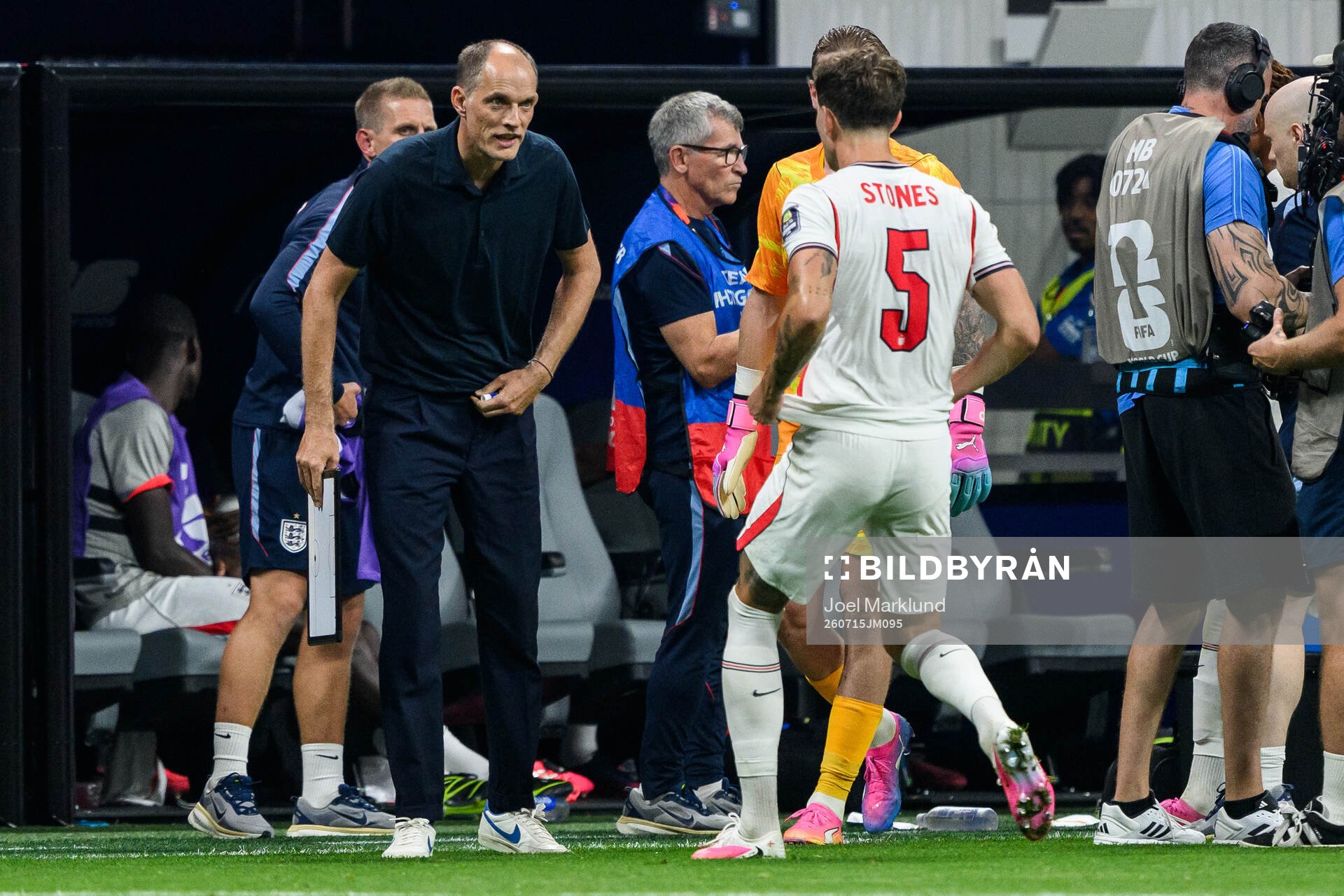 Head coach Thomas Tuchel and John Stones of England