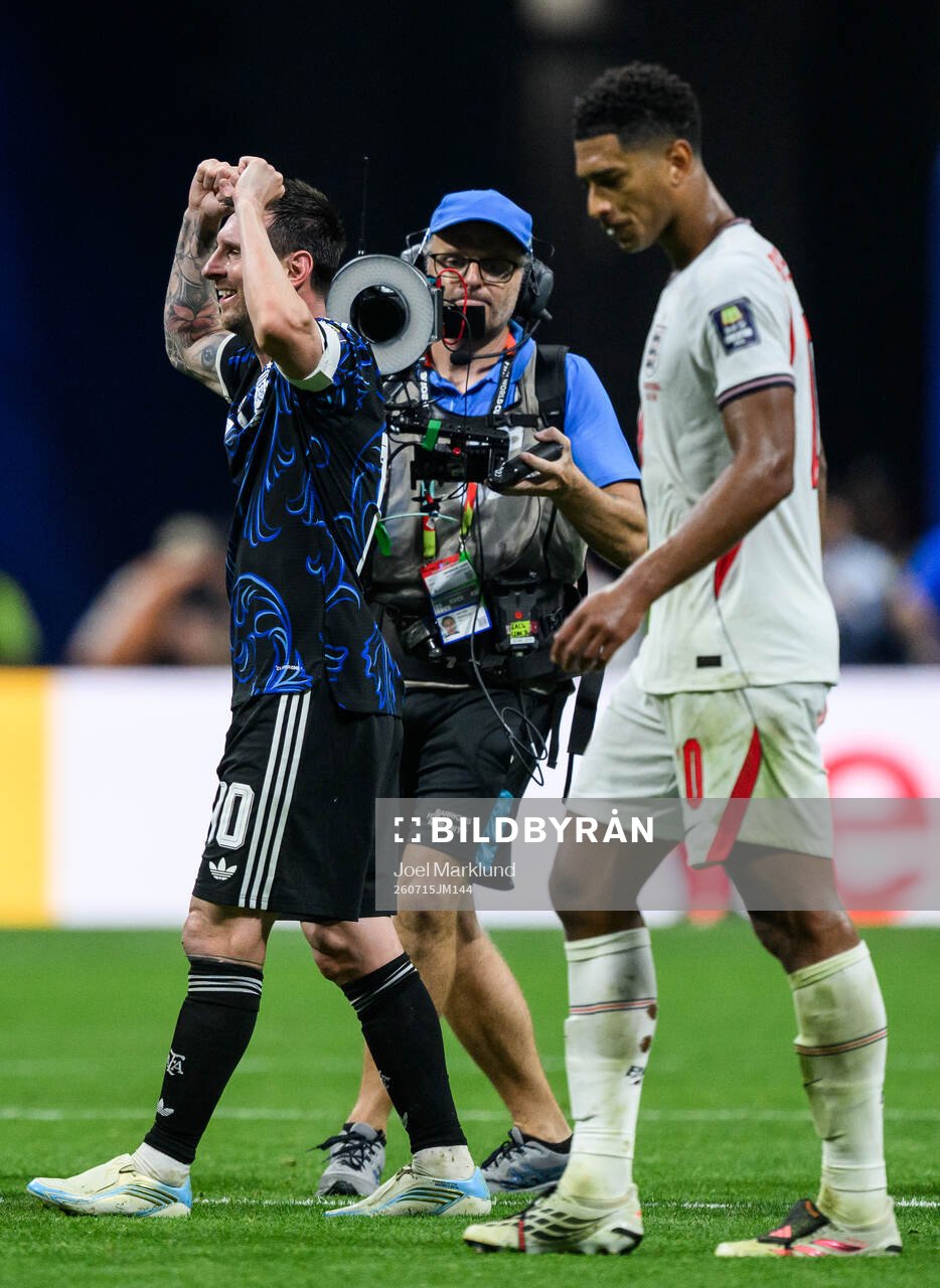 Lionel Messi of Argentina celebrates as Jude Bellingham of